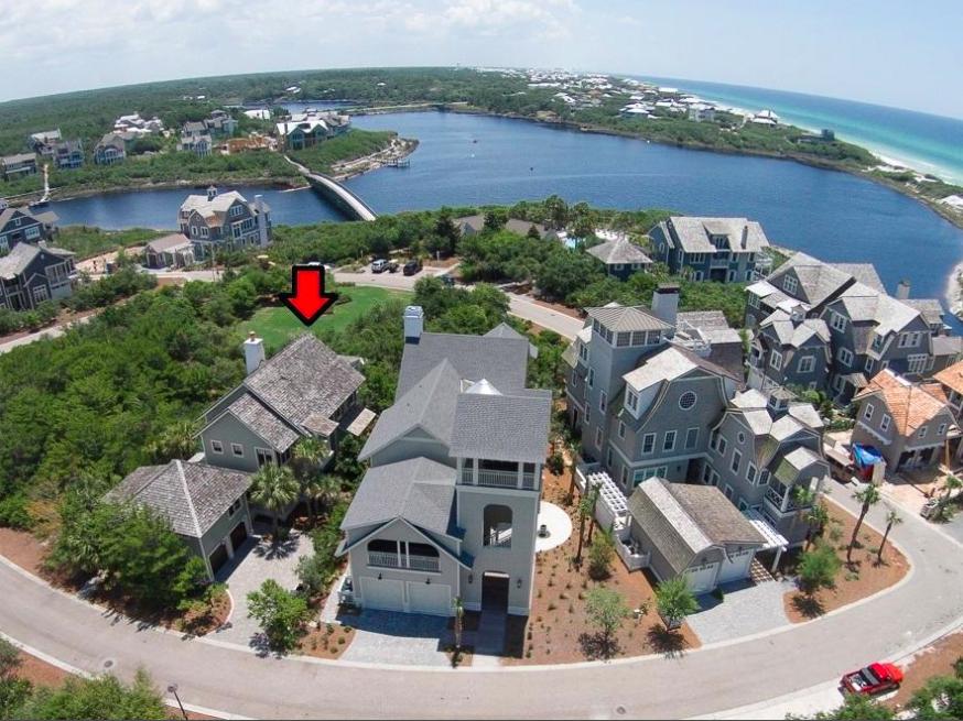 THIS HOME IS CURRENTLY UNDER CONTRACT AND WILL BE CHANGED TO A PENDING STATUS WHEN ALL CONTINGENCIES ARE MET. Phenomenal opportunity to own the best priced home within WaterSound Bridges! Private and serene setting just 200 ft. from the breathtaking boardwalk to the beach. Surrounded by ultra luxury homes and a natural environment, this location stands apart from the rest. The accessibility to amenities is superb with a manicured green space bordering the back of the home and a fantastic pool & sun deck just past that. A pond and walkway is directly across the street from the front of the home and the rear boasts permanent views of Camp Creek Lake, rare coastal dunes and the emerald green waters of the Gulf of Mexico. This is a stunning custom built 4-bedroom home & 1br carriage home desig The home is complete with a 2-car garage with guest quarters above including a beautiful granite kitchen and ensuite bathroom. There is an additional storage closet below that is the perfect size to store bikes to enjoy the area with. The main home features a first and second floor master suite making this home perfect for large families. It would make a great rental property or full time residence. Currently the home is a non-rental and is very well maintained. Attention to detail is apparent and every nook of the home has been thought out. Even upon entry by the stairwell there is a lounge area and small wet bar including a sink, wine fridge and ice maker. Stunning hardwood flooring extends throughout the home with beautiful tile and granite in the bathrooms. The lower level master is fantastic with a private screened-in porch offering secluded, wooded views of the park and there is a stairwell that leads to the upper level balcony where you can take in the Gulf views. This master has a walk-in closet and en-suite bathroom with large soaking tub, separate shower and double vanity. There are two additional rooms downstairs each with ensuite bathrooms. One room offers two twin beds and the other is currently being used as an additional living area. 

The upper level features an incredible great room with high vaulted wood beam and paneled ceilings with built-in recessed lighting and an gas fireplace with masonry surround. The living & dining area opens up to a spacious balcony with views of the dunes, lake and Gulf of Mexico. This is a great place to relax, dine or entertain and there is uniquely a stairwell that leads to the lower level screened-in porch. 

The kitchen is also impressive with granite countertops and breakfast bar, beautiful natural wood custom cabinets, white farm sink and high end Viking appliances. The gas range stove, microwave and oven are stainless steel and the fridge and dishwasher have custom wood fronts to blend in perfectly with the cabinetry. There is a pantry for additional storage and a half bath on this level for convenience while entertaining. 

The upper level master suite offers Gulf views, wood flooring, beautiful vaulted ceilings and an en-suite bathroom with walk-in shower and double vanity. There is also a private Juliette balcony with great sunset views. Exterior finishes include a combination of wood lap and shingle siding and a wood shake roof with copper flashing along with a paver stone driveway. The floor plan will accommodate large families and the location is prime with the easy access to amenities and the beach!