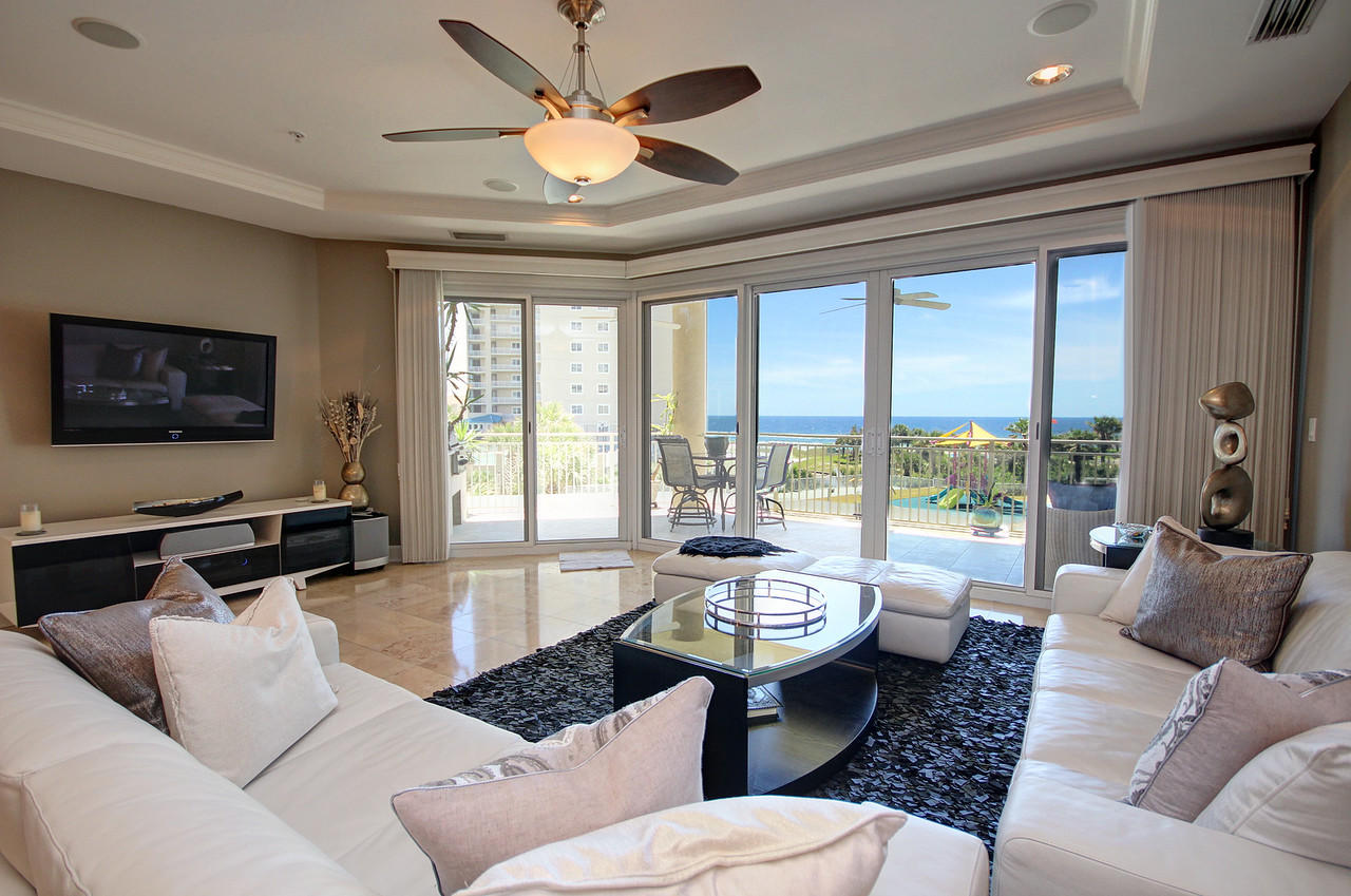 This is an absolutely incredible value for Grand Dunes and the Owners have just upgraded the interior of this beautiful Villa to include; ''Artic Ledge Stone'' in the Private Foyer, ''Faux'' painted walls with Venetian Plaster, new paint in the living area and so much more! It offers incredible views, located 3 stories above the magnificent Gulf of Mexico! Furnishings to be negotiated at contract signing, this villa is exquisite, offering large luxurious finishes with spectacular views! Features of this unit include; solid interior doors, travertine flooring in the main living areas and baths, gorgeous hardwood floors in the master, along with "Ralph Lauren" paint on walls, custom granite countertops and vanities with soft close drawers and can lighting, Secure semi-private high speed elevators to place you directly into your private foyer.. 9.5' ceiling with crown accents and trey inserts, 11' deep tiled balcony with built-in stainless steel natural gas grill. ''Super Quiet'' interior, pre-wired for the latest security and audio/visual entertainment and premium stainless steel appliance package. Grand Dunes features include a 200 foot private beach, owners lounge complete with wet bar, refrigerator and wall mount flat screen TV, fitness room, billiard room, adjacent to the lushly landscaped pool and hot tub overlooking the incredible views of the Gulf of Mexico . If you are searching for unsurpassed luxury, in a gated, rental restricted community on the beach, this villa is perfect! Grand Dunes is the "Emerald Coast's Premier Gulf Front Development"!