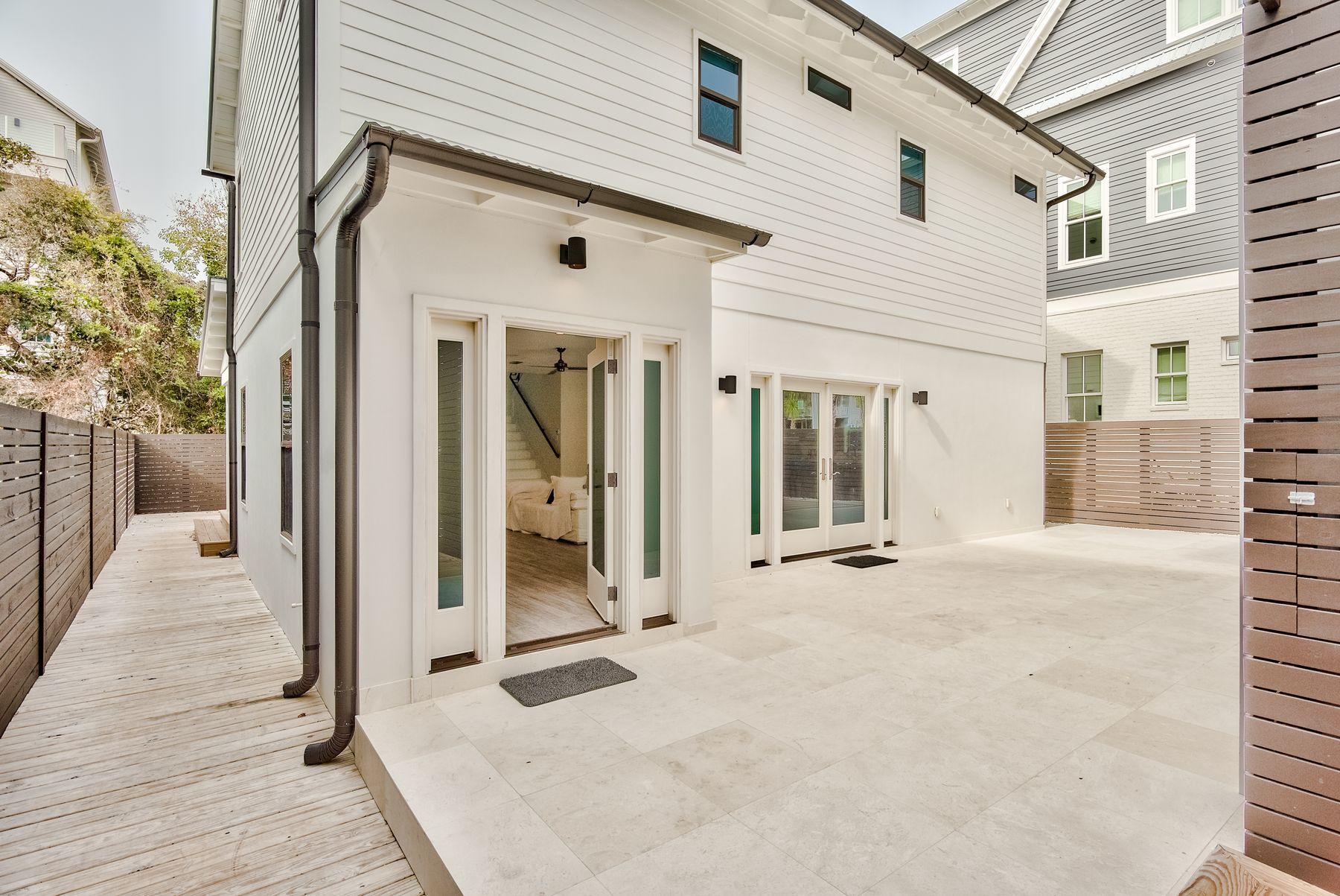 This home just 4 lots north of the beaches in Old Seagrove was completed in 2017.  The new main home boasts clean lines and crisp finishes.

The first level has an office or bunk room and a 1/2 bath along with the large kitchen and open living and dining space.  High end appliances finish the detail.

The second level has two luxury bedroom suites and the washer and dryer for the home is also found conveniently located for the bedrooms.  

The secondary cottage is a full living accommodation that was fully renovated in 2017 and 2018.  It has completely new interior finish including a kitchen, dining and living on the first level along with a full bath and a loft king bedroom area with a 1/2 bath on the second level.  

Rented together or separately, the possible income exceeds $130,000
