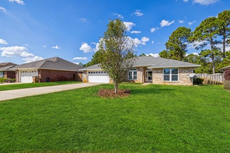 This Amazing Home has new AC UNIT NEW ROOF NEW WINDOWS AND NEW LUXURY VINYLS PLANKING FLOORING. This 4 bedroom, 2 bath, all brick home is conveniently located to Hurlburt Field and the beautiful beaches of Navarre Beach. Home offers vaulted ceilings in the living room, plant ledges, formal dining area with breakfast bar. Master bath has a garden tub and separate shower. Fenced backyard. Buyer to verify all measurements deemed important.