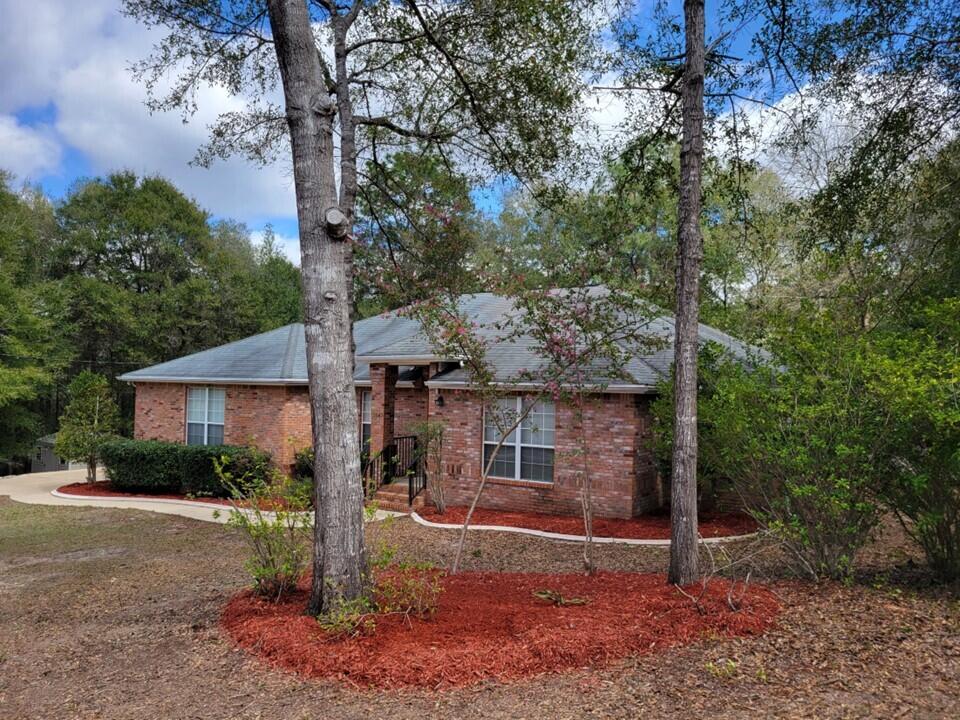 !! BRAND NEW ROOF  !!   NEW DECKING !! This lovely home is nestled in a quiet neighborhood with lots of privacy. Plenty of room for the whole family. Fenced in back yard (Synthetic fence material for low maintenance) that is great for kids and pets. There is a bonus room that would make a great home office or play room. There is even a Florida room that opens to the back  deck.  Easy access to bases and shopping. The 2 car garage is large with a high ceiling. Open kitchen with granite counter top and Stainless Steel appliances. Solar panels on the roof help keep your electric bill low.   Laundry room with storage cabinets.  This house has everything you need and has a great floor plan.  There is even a fireplace. Property lines in picture 3, are approximate.  Picture 3 is not a survey.