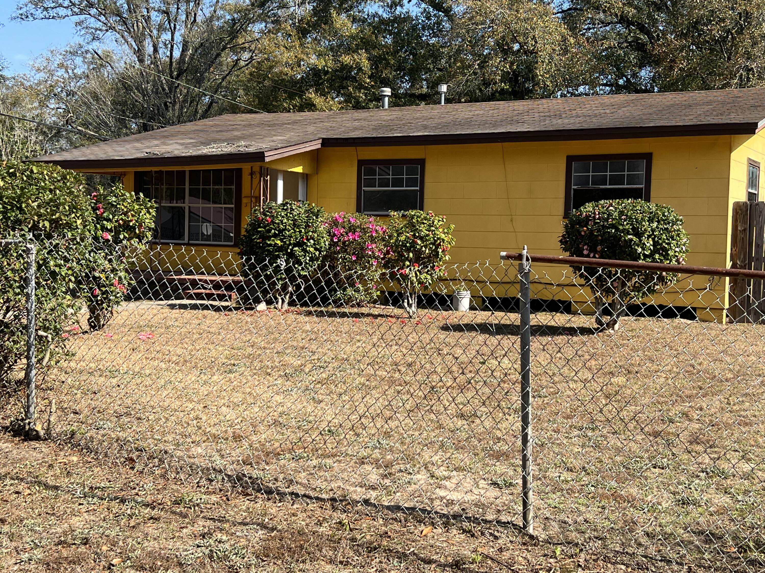 THE HOUSE IS SELLING AS IS, NEEDS WORK, BUT A NICE SIZE AND LOTS OF PARTENTIAL, GREAT FIXER UPPER AND A GOOD RENTAL IF INTERESTED.THE LOT CONSIST OF LOTS 1&2, A NICE SIZE YARD SITUATED ON A CORNER LOT.  (Please note the interior measurement may not be quite accurate, please measure for yourself and satisfaction, also not sure about the hot water heater if it is elec or gas as that is boxed in).  The house has the old time gas heater in the living room.