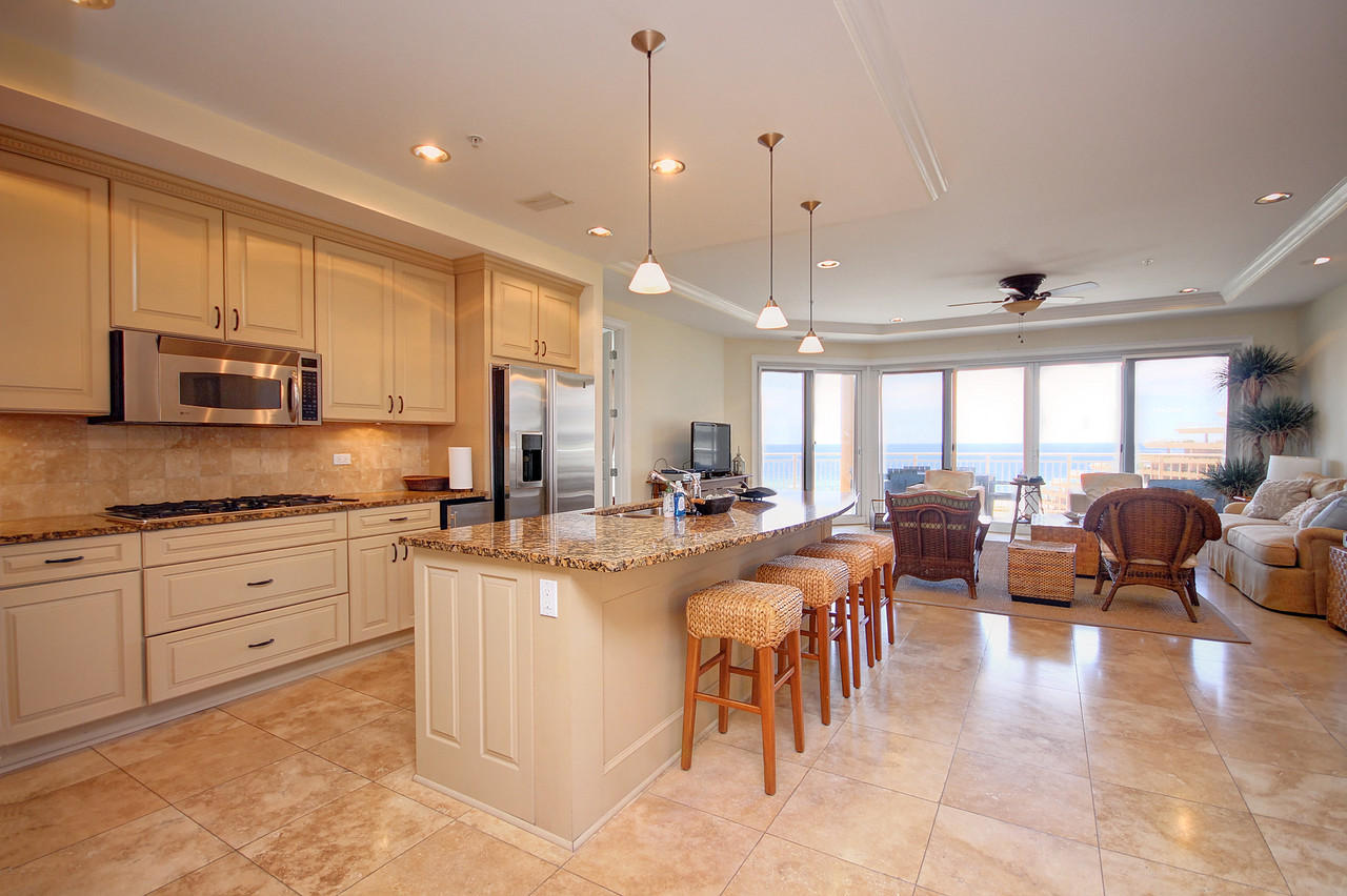This magnificent 4BD/4BA West End Villa is located in Grand Dunes North Tower the premier, gated and rental restricted resort in Miramar Beach Florida. This Gulf front unit on the 5th floor of residences is sitting 8 stories above sea level, providing incredible views of the sugar white sands and emerald green waters of the Gulf of Mexico. Being sold furnished thus allowing the buyer to move in and start enjoying the coastal lifestyle immediately. Beautifully appointed with travertine flooring in the foyer, living areas, kitchen, hallways & baths, granite tops cover the custom wood cabinetry with soft close drawers. Upgraded lighting fixtures illuminate the chef's kitchen which is adorned with premium stainless steel appliances, 5 burner natural gas cooktop and under counter icemaker. The lifestyle continues into the outdoor living space offering a tiled covered 11' wide balcony with over 350 sq.ft. and a built-in stainless steel natural gas grill. Grand Dunes offers a host of wonderful amenities; 200' of private beach,  private heated pools and hot tubs, gulf front lagoon pool, semi-private high speed elevators, gated underground parking, 24 hour security, gated entry, lush landscaping and beach service. Please call to set up your appointment for a private viewing of this west-end corner unit, Grand Dunes is the "Emerald Coast's Premier Gulf Front Development"!