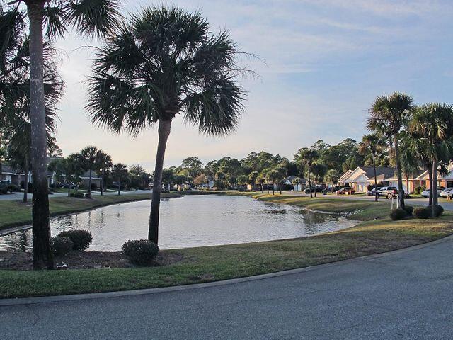Welcome Home to this beautiful, well maintained and freshly painted brick home in the highly desirable waterfront community of Marsh Harbor!  Enjoy lake views from your front porch and take a 2 minute stroll to reach the neighborhood's deeded access to it's  private boardwalk, pier and community beach directly on the Santa Rosa Sound!!  Easy entry to the water for swimming, fishing,  paddle boarding, kayaking or canoeing!  Or if you'd prefer to just relax on the beach, bring a blanket or chair and enjoy the beauty and wonder of the magnificent Sound!  The dock has built in seating where you can sit and watch the  gorgeous FL sunsets along with the myriad of marine and wild life in the area!  You'll also enjoy a peek-a-boo view of the sound from the home's private back deck!  The home is light and bright and has an open floor plan that features vaulted ceilings in the kitchen and living areas making the home feel super spacious!  It lives even larger than its stated square footage!  The home offers a second living area or flex room at the front of the house as you enter.   From the entry, a hallway guides you in to the heart of the home, the open and spacious kitchen and family room area!  The split bedroom plan affords privacy with the master suite on one side of the home and the secondary bedrooms and a full bath on the other side of the home.  The master bedroom is huge and the spacious master bathroom features a garden tub, separate shower and an expansive walk-in closet.  Large windows along the back of the home flood the home with light and affords you the gorgeous and private views of the undisturbed natural area behind your deck.  StormBreaker Low E Hurricane windows were installed in 2011 for your protection and comfort!  Marsh Harbor is only minutes away from Hurlburt Field and a short drive to Navarre Beach and Okaloosa Island when the Gulf is beckoning you!    Due to time constraints and the fact that the home is currently occupied by tenants, the listing photos are those used when the home was listed in 2019.  The interior has just been freshly painted with neutral grey walls and crisp white trim!  The bathroom vanities and mirrors have been upgraded also!  This home is a Must See!!  Welcome Home to Marsh Harbor!