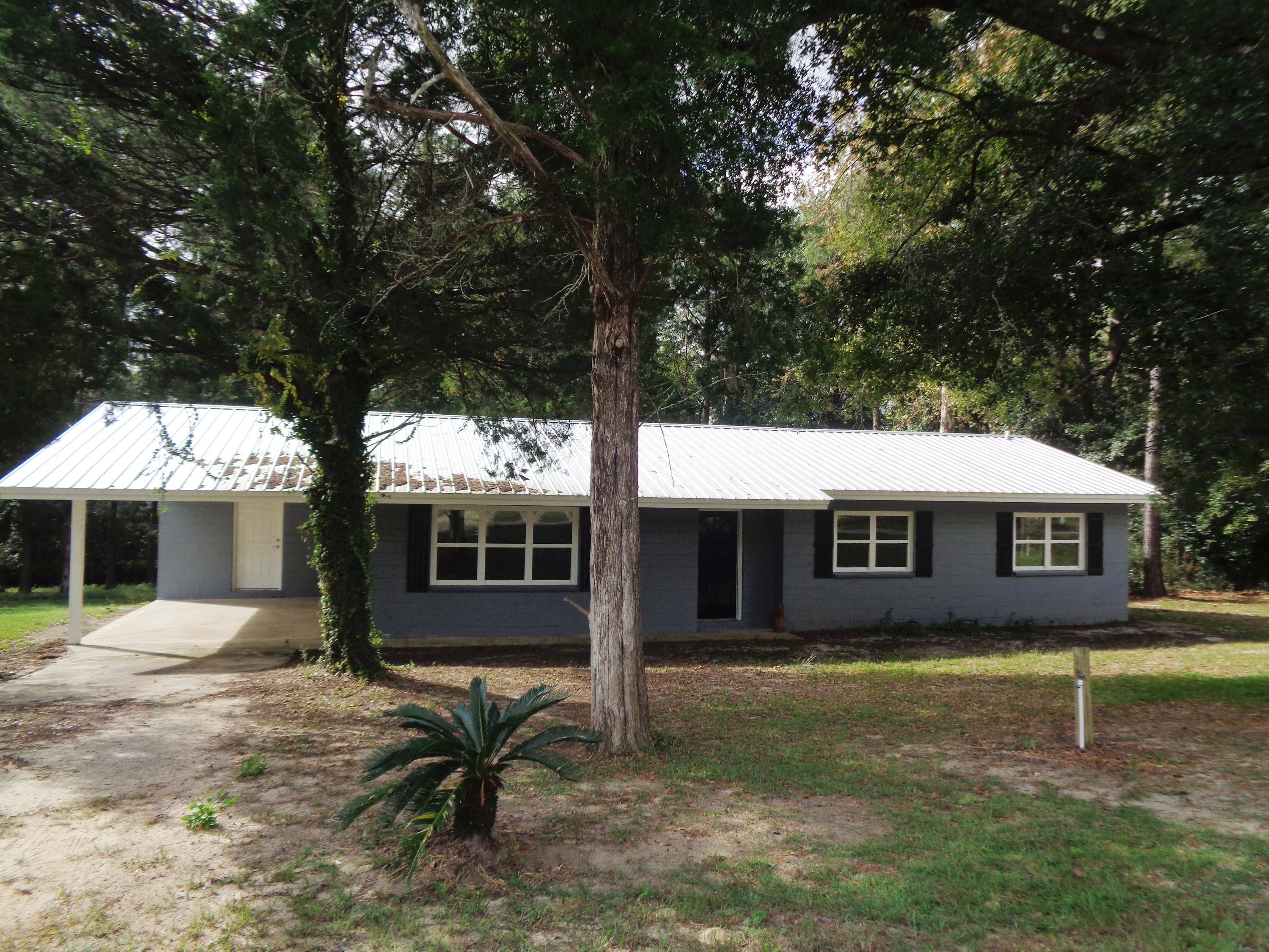 GREAT BUY IN THE PAXTON COMMUNITY. THIS HOME OFFERS 3 BEDROOMS AND 2 BATH, LARGE OPEN LIVING ROOM PLUS A LARGE UTILITY. HOME HAS BEEN TOTALLY REDONE, NEW WINDOWS, NEW ROOF, NEW FLOORING, ALL NEW KITCHEN CABINETS AND TONS MORE! THE MASTER SUITE OFFERS A LARGE WALK IN CLOSET, LARGE TILE MASTER BATH, AND A GREAT SIZE BEDROOM. HOME HAS A LARGE LOT WITH A STREAM. HOME IS LOCATED AT END OF ROAD FOR PRIVACY.