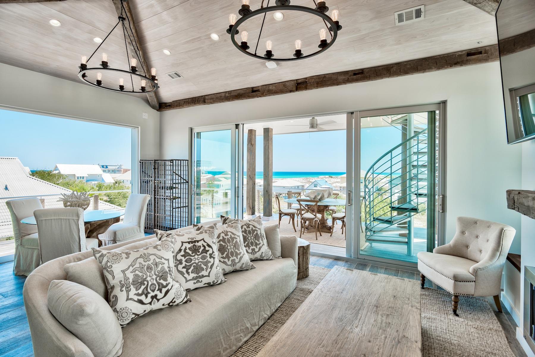 Discover a one of a kind, modern 4 bedroom, 4 bathroom masterpiece in sought after Grayton Beach. Boasting forever Gulf and coastal dune lake views this is a home that exceeds the expectations of modern luxury. Meticulously designed with unparalleled attention to detail and style, revel in the truly decadent outdoor living areas, including a sparkling heated private swimming pool, beautiful balconies and porches to soak in the views and a rooftop deck with Kitchen Aid gas grill, ideal for dining alfresco and watching the gorgeous Florida sunsets over the Gulf. Inside you will find porcelain tile, solid pine doors, Nest thermostats and Sonos speakers throughout, custom staircase with metal beams wrapped in reclaimed wood and a private elevator leading you through the 3 levels. Stylish entertaining or casual family gatherings are no problem with a first level guest bedroom and second kitchen with custom welded stainless steel countertops and appliances that can also be used for catering. Upstairs, the open and spacious floor plan offers living area with oak and cherry reclaimed beams from Louisiana and North Carolina, clear cypress ceiling, Napoleon gas fireplace and slider doors that leads to large balcony complete with gorgeous water views. The main kitchen is a showpiece with custom glass cabinets, marble counters and Thermador stainless appliances. The master suite features a Cypress barn door from New Orleans and ensuite bath with claw foot bathtub and rainfall shower head. All of the guest bedrooms include private balconies, walk in closets and ensuite bathrooms, which provide privacy as well as exceptional rental opportunities. The two car garage is tall enough to house a class B RV as well as a golf cart. This is truly a home for a lifetime.