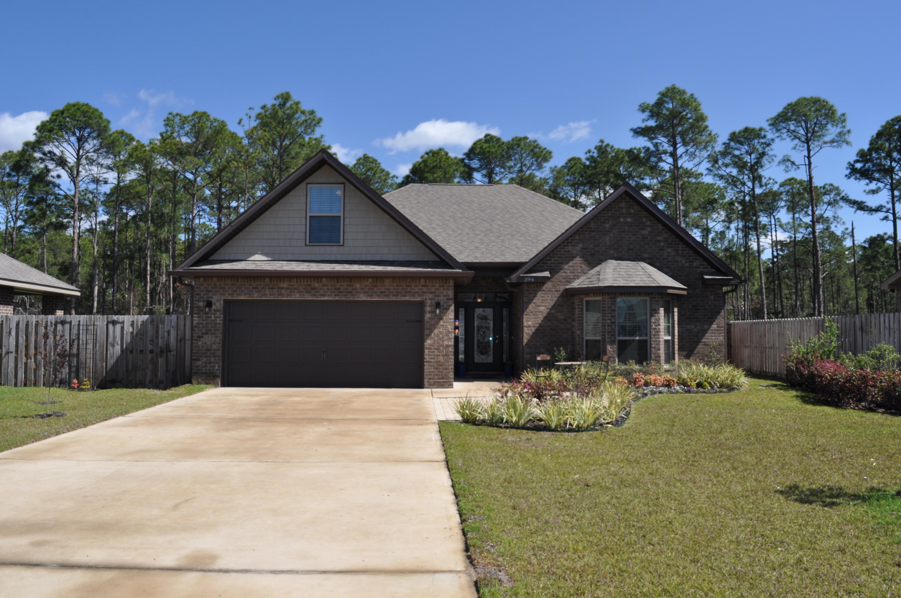This brand new home, the Madeline plan, features 2,233 sq. ft. of open living space with second story bonus room. This must-see 3 bedroom; 2 bath home includes a sunroom, a covered patio, fence and 2-car garage. Other highlights include, granite in the kitchen & bathrooms; custom backsplash, elegant tray ceilings in the master bedroom; open living room; dining room; kitchen offer homeowners a relaxed & airy feel. Driftwood Estates Community is a desirable neighborhood situated minutes from the Beaches of South Walton and 30A. Community features include a pool, ponds, sidewalks, parks and beautifully landscaped common areas. Driftwood is positioned minutes from Sacred Heart Hospital, Walton county Schools, shopping, dining, and entertainment.