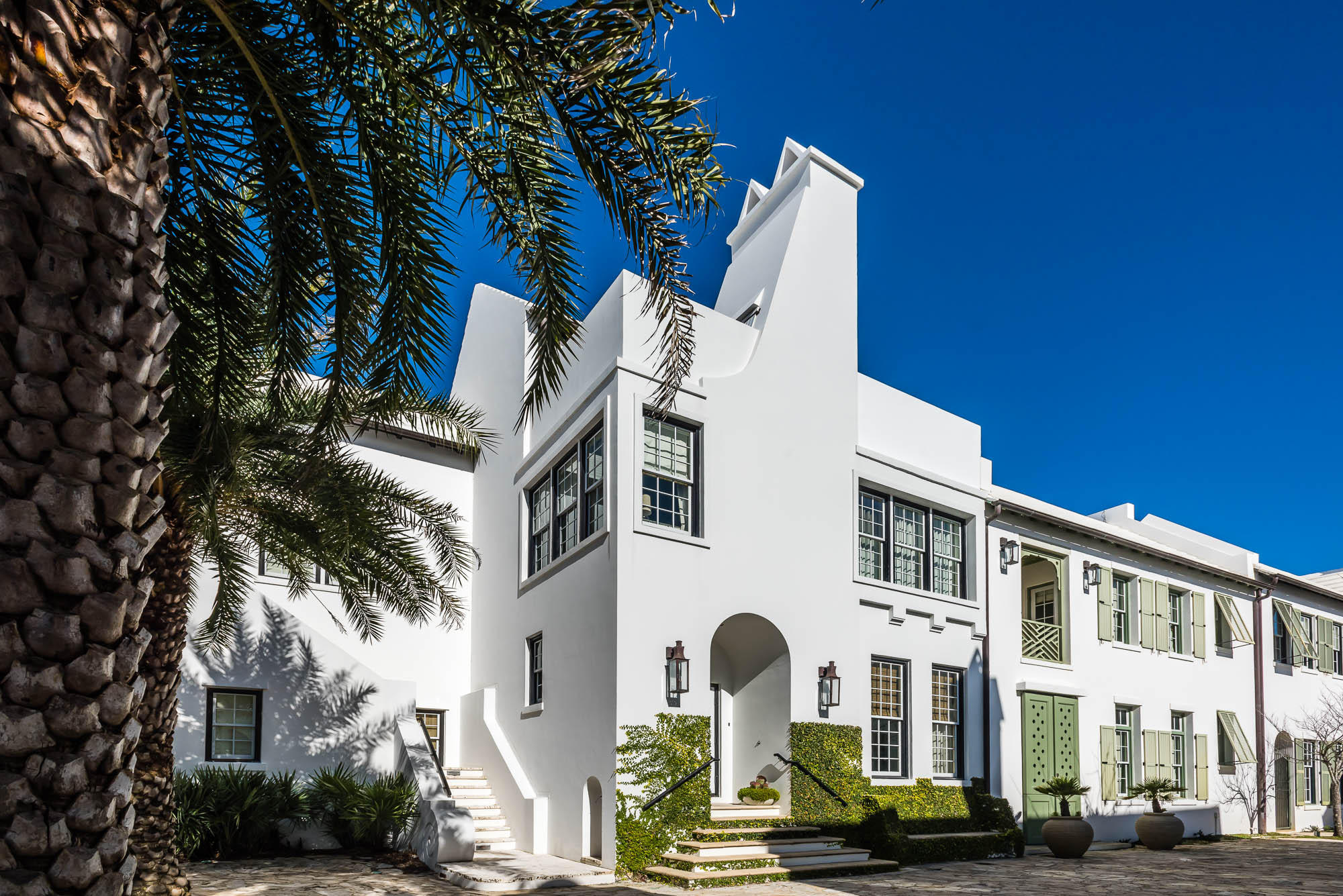 This stunning 3 bedroom, 2 1/2 bath home was designed by the renowned architectural firm and Town Planners of Alys Beach, Duany Plater-Zyherk (DPZ). The firm's founders and principals are Andres Duany and Elizabeth Plater-Zyherk, recognized leaders in the New Urbanism movement to combat sprawl and return to walkable, human-scale towns. Owning a home designed by DPZ is certainly a coveted opportunity, especially in the town of Alys Beach.
The living room, kitchen and master bedroom feature expansive windows that give colorful views of the courtyard and pool, creating a seamless transition between indoor and outdoor living.The kitchen is professionally equipped with top of the line stainless steel appliances, marble countertops, custom cabinetry, and Italian limestone flooring. The second floor has two guest bedrooms and a study overlooking Sea Garden Walk pedestrian path. The third floor boasts a terrace with built in grill and dining area overlooking the beautiful  Sea Garden Walk pedestrian path leading to the Gulf of Mexico and  Lake Marilyn. This home is built to "Fortified ... for safer living' standards. With professionally designed decor and new furnishings, this home is being sold furnished. Personal items do not covey. Parking Ct. Fees are $150 per quarter
