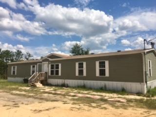 Come see this 5 Bedroom manufactured home on 6 acres with a spring fed lake. This home has a large family room with fireplace, large kitchen with island an breakfast bar, roomy master bedroom and bath, 4 additional bedrooms and two additional baths! Come see this lovely home. Pet considered case by case. Horses allowed!
