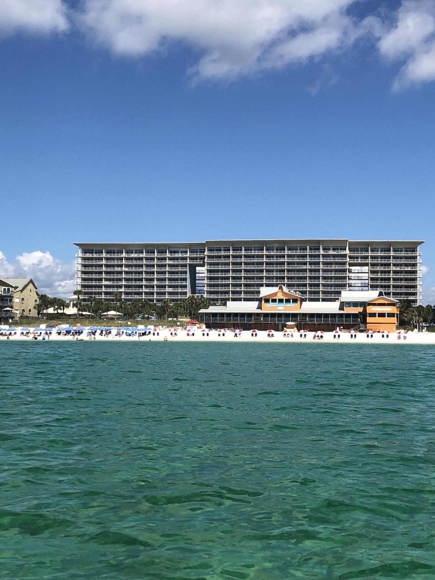 Looking for a retreat or short term rental in the heart of Destin with tropical gardens, fantastic amenities and a dreamy oasis pool? Then Unit 212 at Sterling Shores is ready for you! $22,700+ already booked for 2022! Enjoy the  lagoon-style pool set amidst lush tropical landscaping which also has a play area for kids of all ages.  For those who love the beach you will enjoy 400 feet of deeded private beach access which features a private gulf-side beach club with a 1,000 sq. ft. pool (heated seasonally), snack bar (open seasonally), restrooms, shower, lockers and beach access. Other amenities include on-site rental, fitness center and theater room. The condo is centered near many restaurants and plenty of stores for shopping.

Inside the condo you will enjoy a newly updated master bedroom with hall bath and tub/shower surround. The living room is bright and inviting with neutral paint and white kitchen cabinets. The kitchen appliances are all stainless steel, and the large island allows for a wonderful place to enjoy a meal. The couch is a pull out which accommodates 2 additional guests making this unit capable to house 4 people. The large balcony has room for a table and chairs along with a couple of lounging chairs. The full-size washer and dryer convey with the sale. The HVAC is 2011 and water heater is 2015.