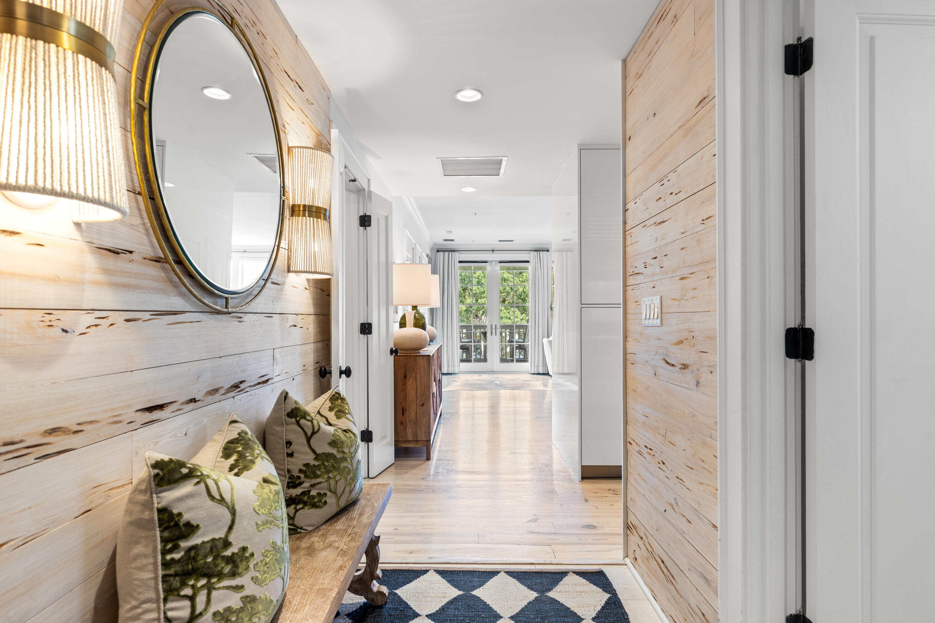Sophisticated and serene, this beautifully appointed residence offers timeless design and a prime location in the heart of Rosemary Beach. Inside, whitewashed pecky cypress walls lead into a spacious open-concept living and dining area, anchored by a sleek Italian kitchen featuring top-of-the-line Wolf and Sub-Zero appliances. The floorplan is thoughtfully laid out, with each of the three bedrooms set in its own private wing—providing ideal separation for guests or family. Marble-accented bathrooms, custom built-ins, and warm hardwood floors add to the home's polished feel.

From the balcony, enjoy views overlooking Barrett Square and the striking coastal architecture that defines the Town Center. Just a short stroll to world-class dining, shopping, and seasonal events, this residence offers the perfect blend of convenience and quiet retreat. An exceptional offering in one of 30A's most beloved communities.