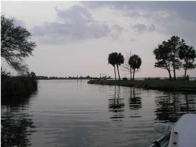 Local discounts and owner financing available Call for details. Blissful privacy. Beautiful, peaceful and nicely wooded. 126 feet of deep water canal frontage within 5 minutes of the Choctawhatchee Bay and just a little further to the Gulf. Large cut out for a 20' boat. High and dry lot for a dry homesite. Great fishing, fresh and saltwater. Very quiet neighborhood and close to all the shopping and beaches of South Walton. New houses being built in this area are very nice and expensive. Beautiful mature oaks with moss and hardwoods on the lot. This area is just waiting to explode with beautiful homes on a deep-water canal 5 minutes to the bay.