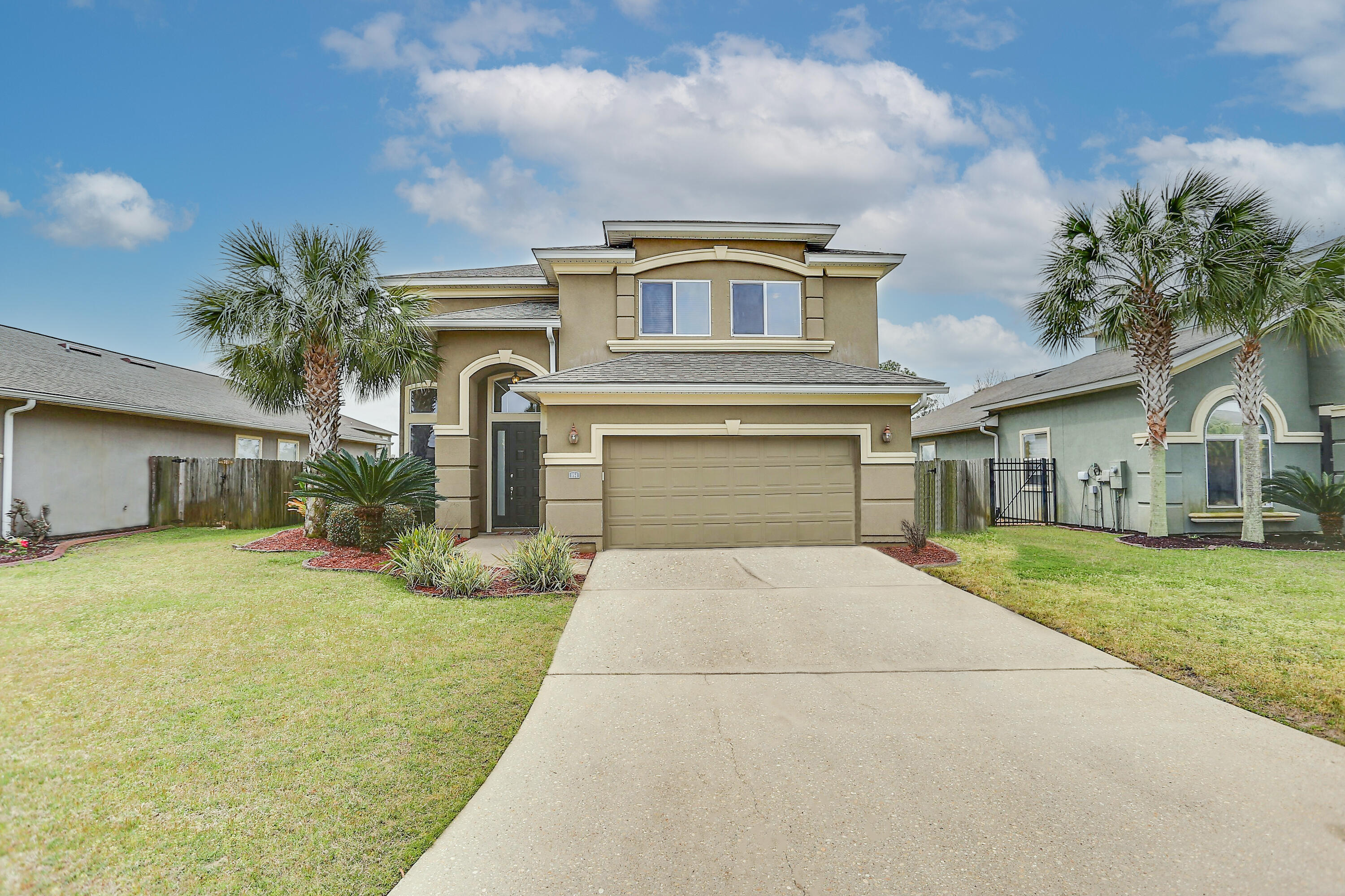 Just minutes away from Hurlburt Field and beaches, this two story, Mediterranean home with a fenced in yard, two separate living rooms, and a bonus loft area is situated in the Solimar community.