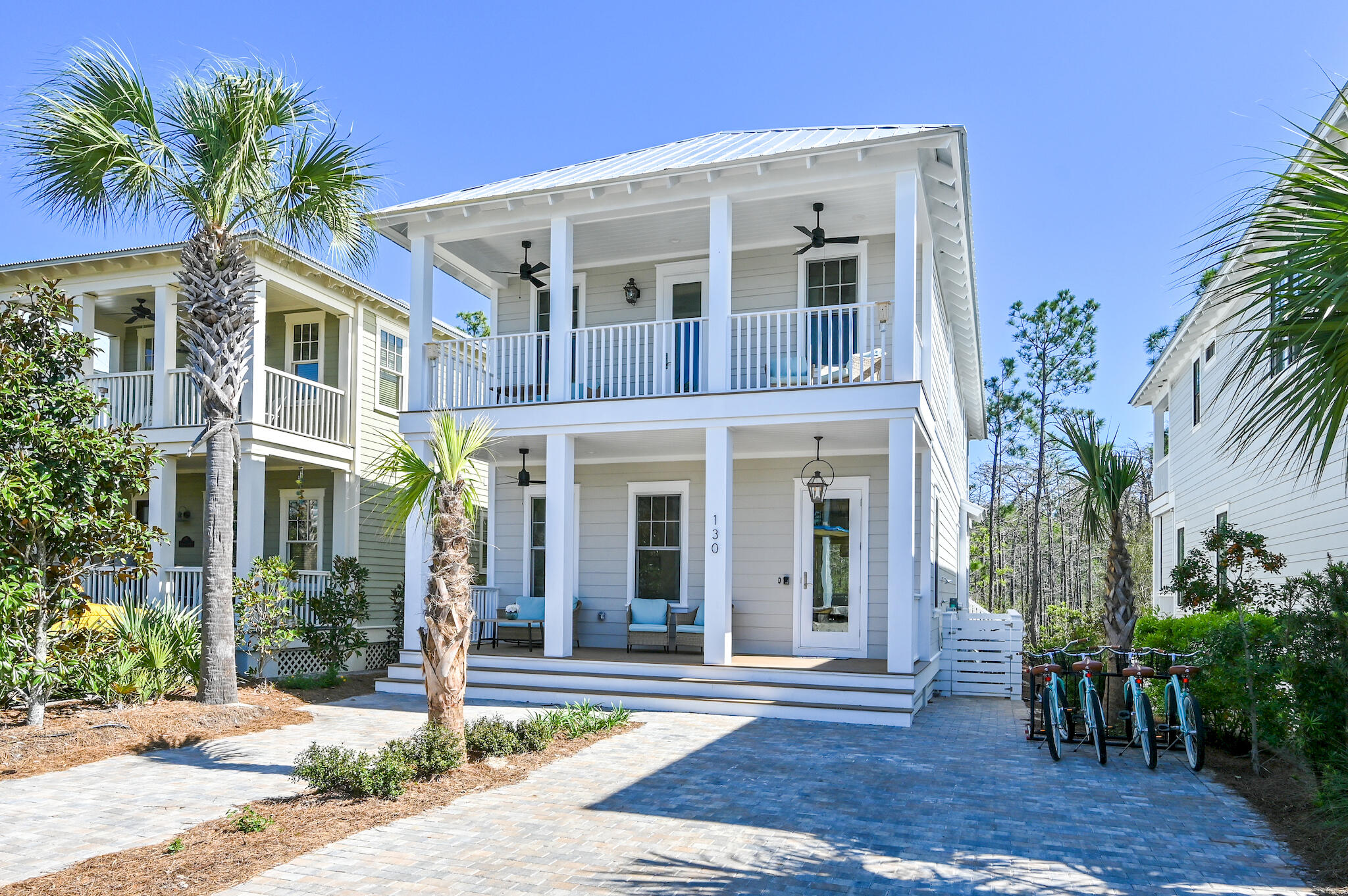 Want a new home without the wait? This is a custom Tango floor plan that was built in 2023! Located on the West end of Scenic 30A in the gated neighborhood of Cypress Dunes! This beautiful home is 2112 square feet, 4 bedrooms, 4.5 baths, coffered ceilings, a fireplace, four separate porches (2 screened in) and is being sold completely furnished with a few exceptions!  Upgrades include all decking on porches are TREX, $20K worth of solar panels (power bill was $317.00 for the year), Sonos speaker system in living, master and 2 porches, outdoor shower, pantry, upgraded lighting, upgraded kitchen cabinets, upgraded wood flooring, 5 brand new flat screen TV's and is wired for an electric car charger at the front of the home. This vacation rental grossed $65K in rentals in its first year with owner usage and only on the rental market for 8 months! This home backs up to the beautiful cypress pond and has a lot of privacy! See document tab for floor plan and dimensions.