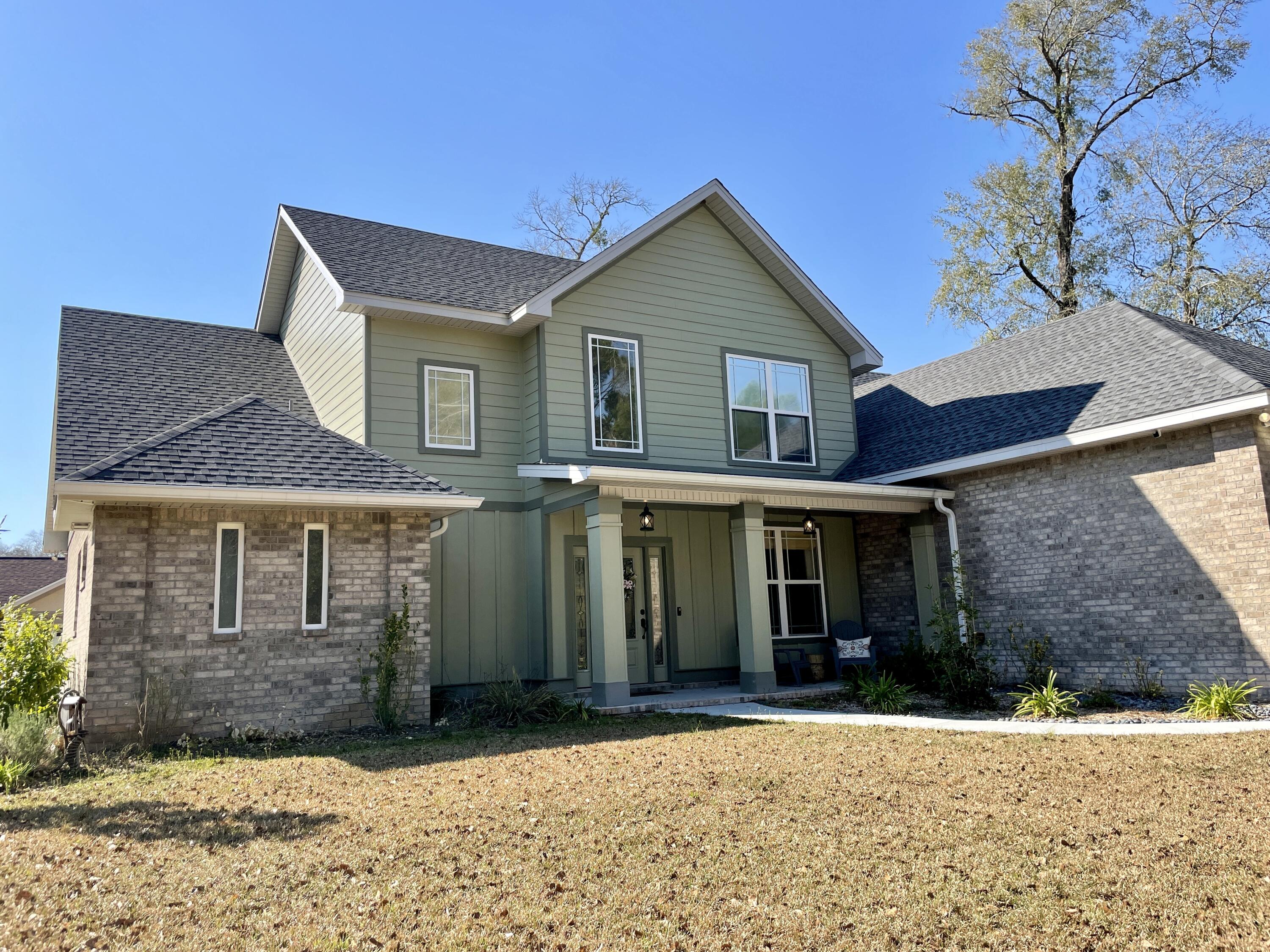 Beautiful, 4 bedroom, 3 bathroom, semi-custom home sits on a corner lot in highly sought after Juniper Creek Estates in South Crestview.  Entering you'll notice the high ceilings and spacious open floor plan of this 1.5 floor home. The open plan allows for a dining area, breakfast area as well as the main living area.  Kitchen features granite countertops, solid wood cabinets, center island, large pantry and stainless appliances.  Kitchen and main living are separated by a nice size breakfast bar.  A large master suite with walk-in closet, soaking tub, separate shower and private toilet room and additional bedroom and bathroom are also located on the main floor.  Upstairs is compiled of two additional bedrooms, a jack and jill bathroom and bonus area (a great computer work space). You'll enjoy sitting on the covered porch in your fenced back yard with double gate and room for a pool.
