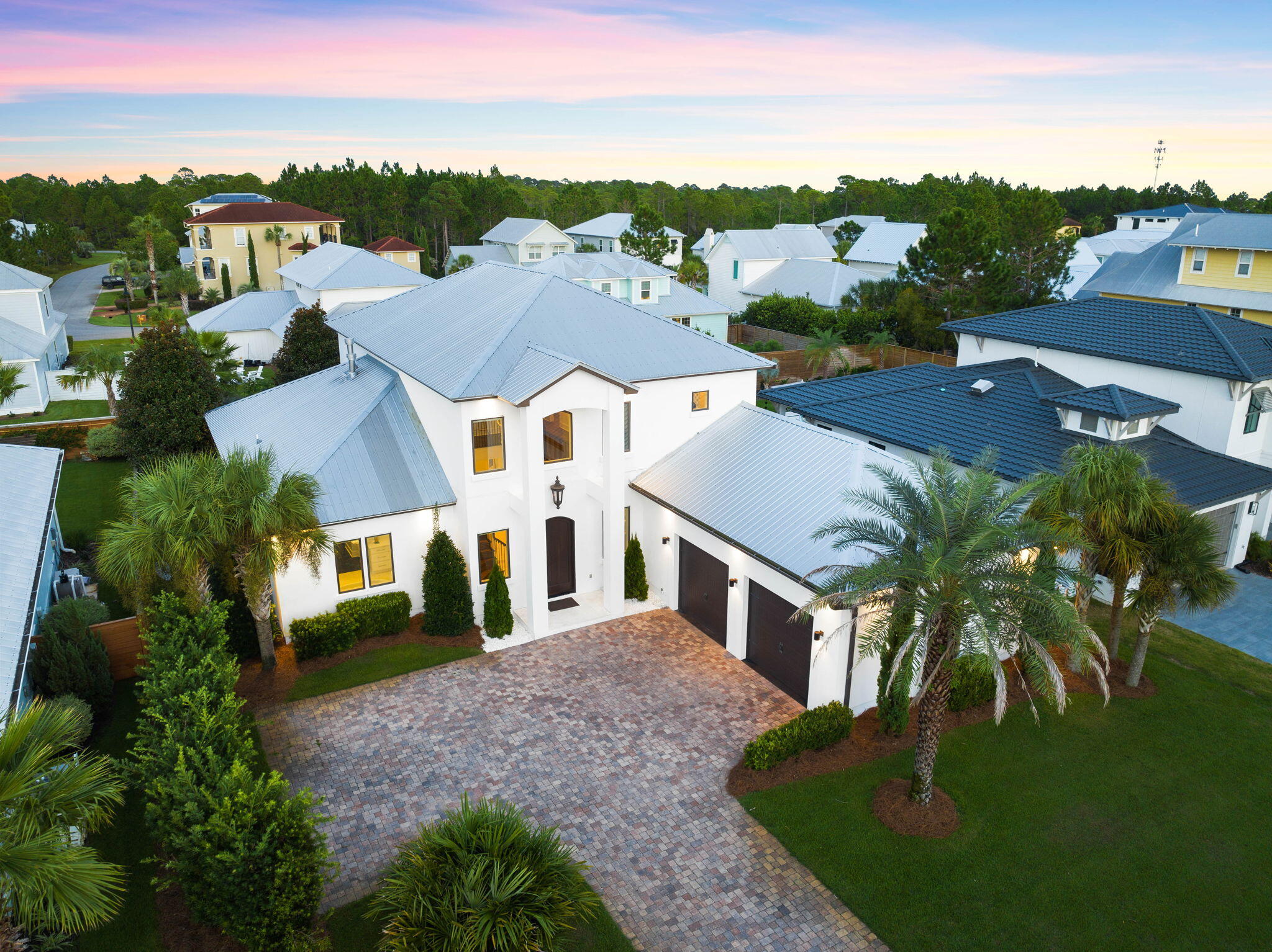 Sophisticated design combined with superior construction greet you upon entry of this west 30A home. Situated in the gated community of Cypress Breeze, the features of this custom-built home are truly endless. The property seamlessly integrates professional design with luxury amenities and stylish selections. Premium materials paired with a well-thought-through floor-plan create a timeless design to be enjoyed for generations to come. As you enter through the grand foyer, soaring ceilings draw attention to a beautiful staircase. Flowing directly from the great room, the living space is created for gathering and entertaining. The space is highlighted by the stunning gas fireplace. From the living, an elegant dining room showcases a taste of the gorgeous lighting found in the home. The large glass french doors welcome you into a true outdoor oasis. Lush landscaping surrounds a beautiful open-air living room offering ample space to lounge and relax while the grill master of the group utilizes the well-equipped summer kitchen and bar.

Back in the interior of the home, the great room features a true chef's kitchen with Wolf Range, Sub-Zero refrigeration, dishwasher, Sub-Zero beverage center, ice machine, walk-in pantry, and more. Stone countertops and luxury plumbing fixtures characterize the quality of the fit and finish of the kitchen. 

The primary suite is located directly off the great room and features a jaw-dropping en-suite bathroom. A large free-standing soaker tub and walk-in glass shower are the highlights of this space. 

On the ground level you will find a stunning powder bathroom, a large laundry facility, an oversized two car garage and work shop as well. 
The upper level boasts a guest suite, two additional guest bedrooms, a well-appointed guest bathroom. You will also locate on this floor the fully equipped media room. This entertainment space is ready for movie nights, football games and more. A wet bar and storage can be found in this room.

Cypress Breeze offers a private gated experience with resort style amenities including an oversized pool. The community is situated within a short stroll to the beach and near the high-end restaurants, world-class shopping and luxury entertainment offered on 30A. Create lifelong memories in this one-of-a-kind curated home.