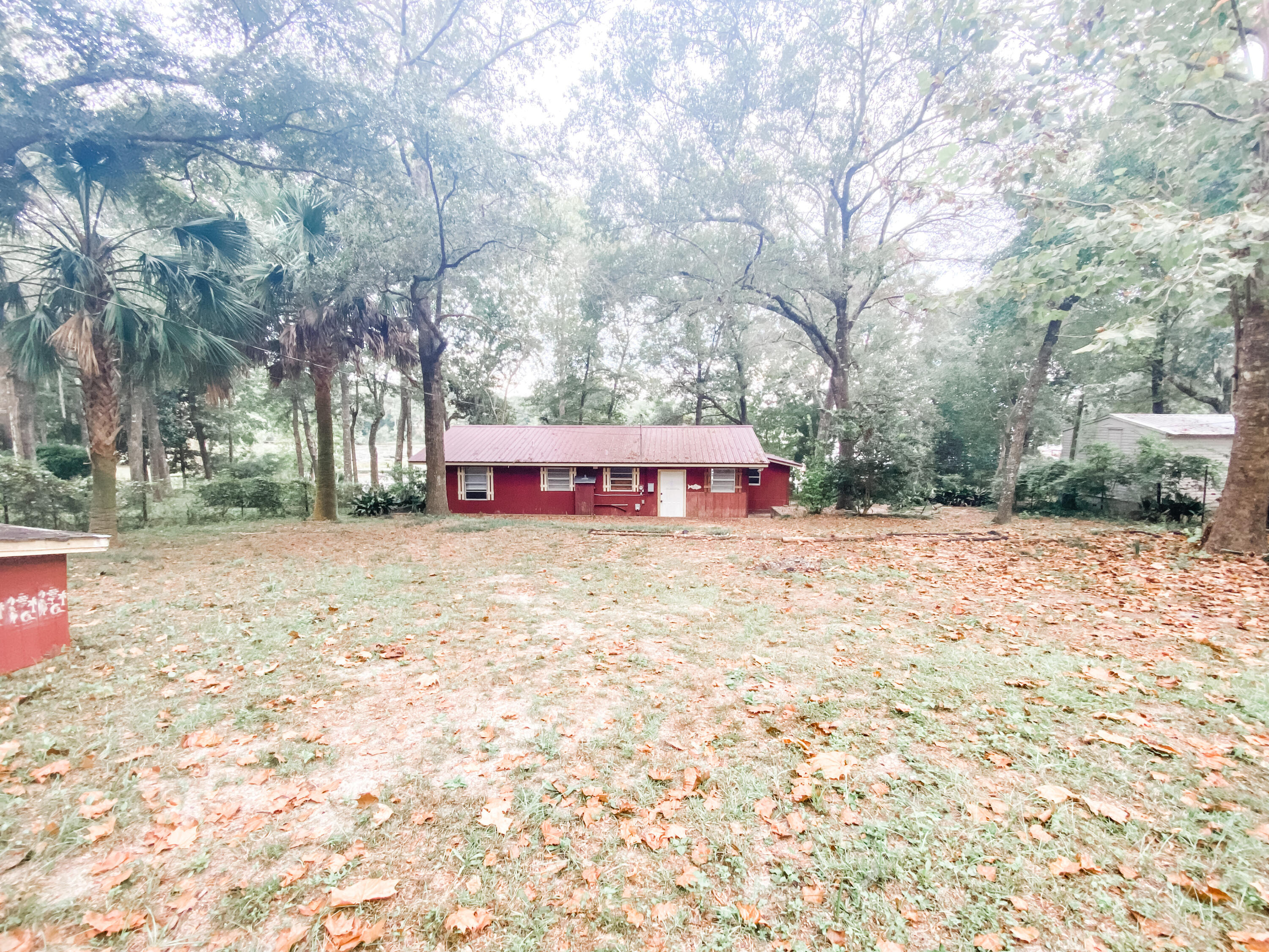 If you are looking for the perfect weekend fishing retreat, this is it! This home has 3 bedrooms, 1 bathroom and an open layout in the kitchen and living area. The enclosed sunroom on the back is perfect for a small family gathering or sipping coffee and watching the sunrise over Lake Juniper. The yard is large and has some beautiful mature trees. There is already a dock in place for the anglers or just to sit and relax! The HVAC was replaced in 2021.