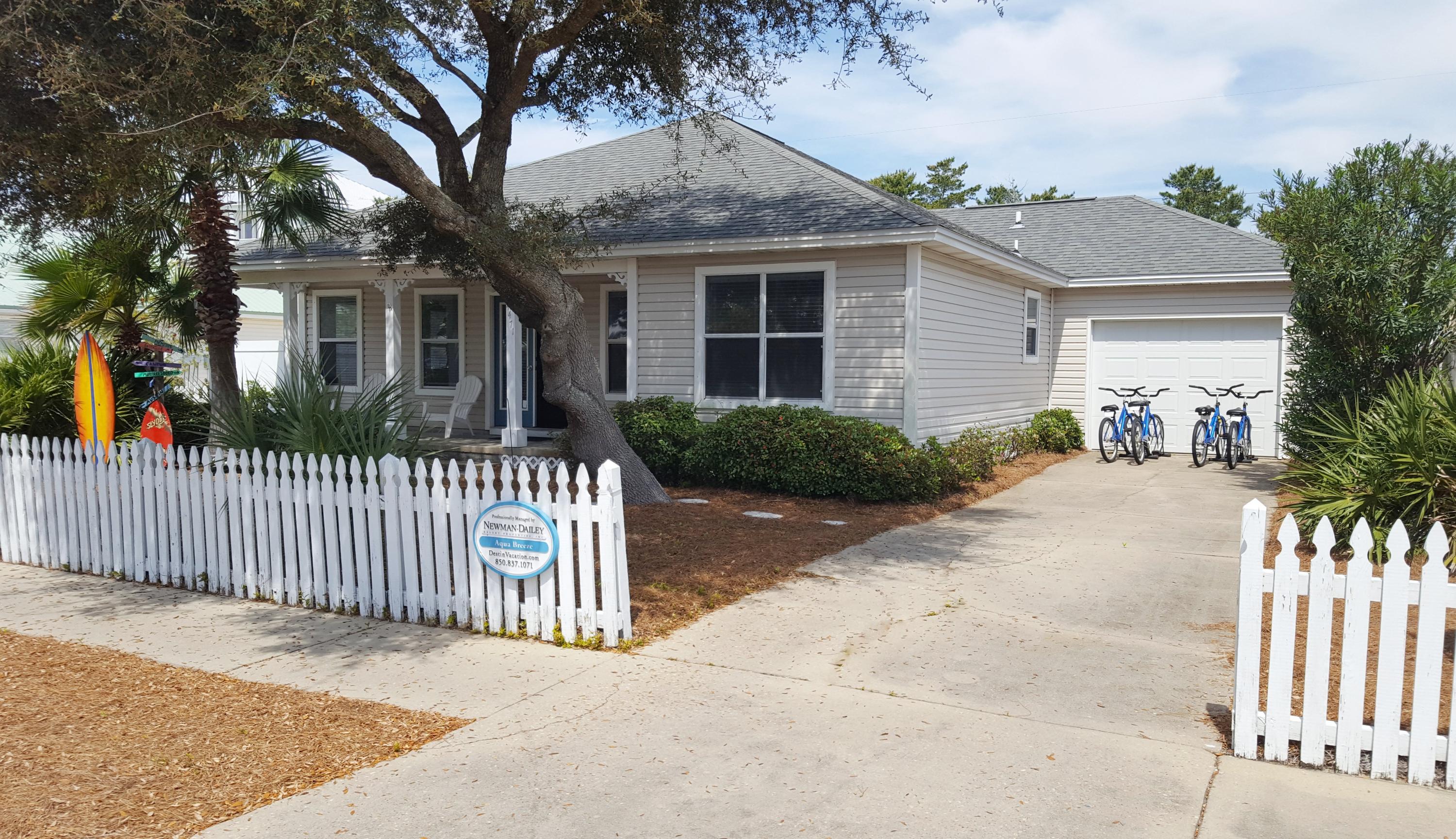 Welcome to Aqua Breeze This cute beach cottage along with white picket fence is the perfect beach getaway located in the highly sought after neighborhood of Crystal Beach. Reach the beach just a couple of blocks south and enjoy the sugar white sandy beach via access with restrooms. Beautifully furnished and renovated with granite countertops in kitchen and all baths along with upgraded tile work in baths as well. There is also Low maintenance wood tile flooring that flows throughout this home. There is also a playroom/craft room off of living room or a home office. An attached garage is perfect for parking or storing golf cart and more toys. This home is conveniently located close to the beach; community neighborhood pool; pedestrian and bike paths; restaurants; shopping; grocery... golf courses more entertainment. You name it. Come and see. This will make the perfect home second home or turnkey vacation rental.