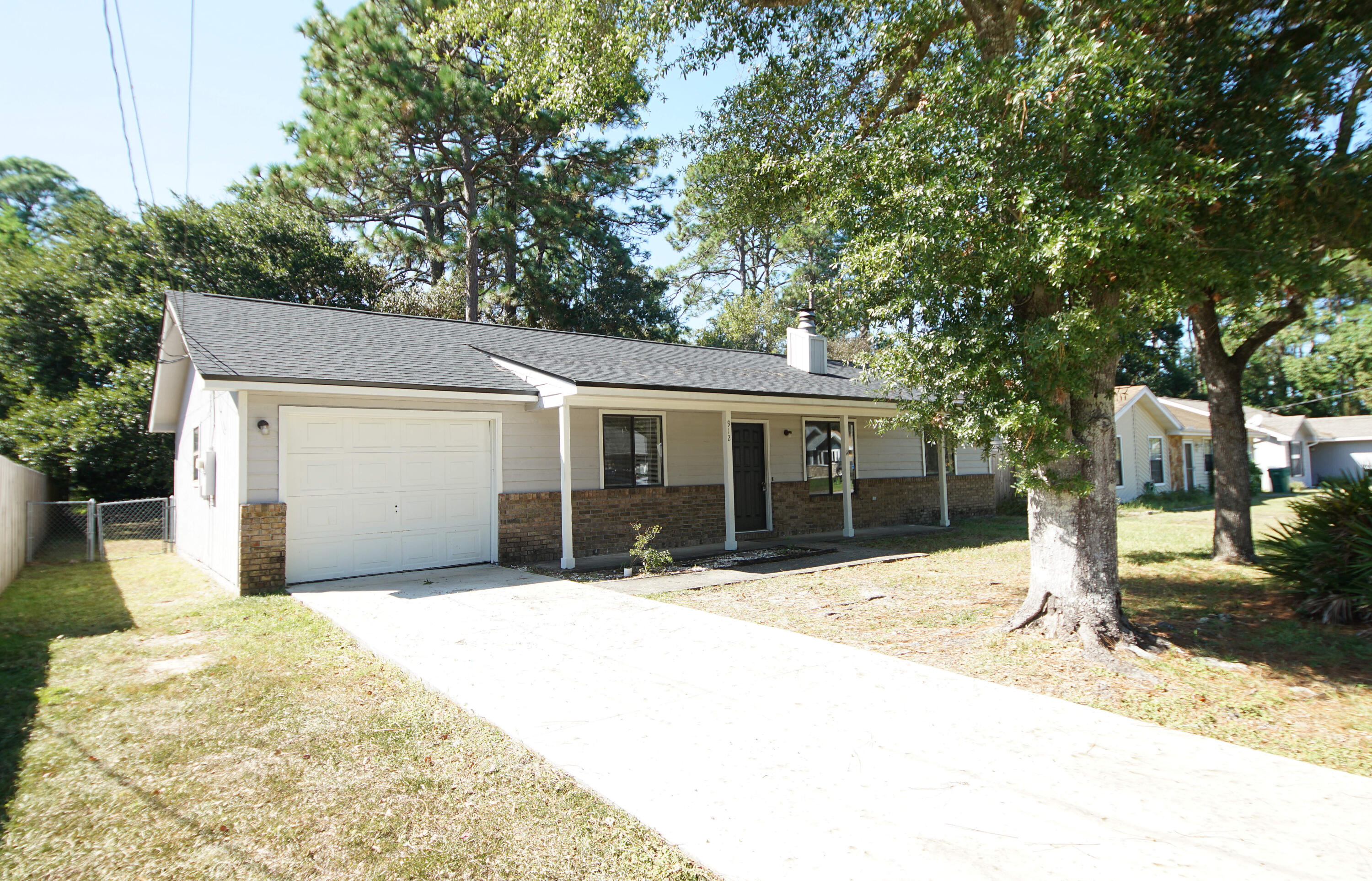 Cute as a Bug! Covered Front Porch. NEW ROOF! New Flooring, New Paint, New Countertops!! This Home is MOVE-IN READY! Centrally Located in Niceville. Just a Short Distance from Shopping, School, and Hospital. The Living Room has a Vaulted Ceiling and a Cozy Fireplace for these upcoming chilly nights. Living Room is connected and open to the Dining Area.  The Split Bedroom Floorplan Allows for Plenty of Privacy. Updated Kitchen with Stainless Appliances has a HUGE picture window with a view of the Mostly Fenced Backyard. Yard Building. Room for a Pool! Sliding Glass Doors from the Dining Area Lead to the Large Back Patio with enough Space for a Grill, Lounge Chairs AND an Alfresco Dining Table. Inside Laundry Room with Pocket Door. 1 Car Garage with New concrete Driveway.  Must See!