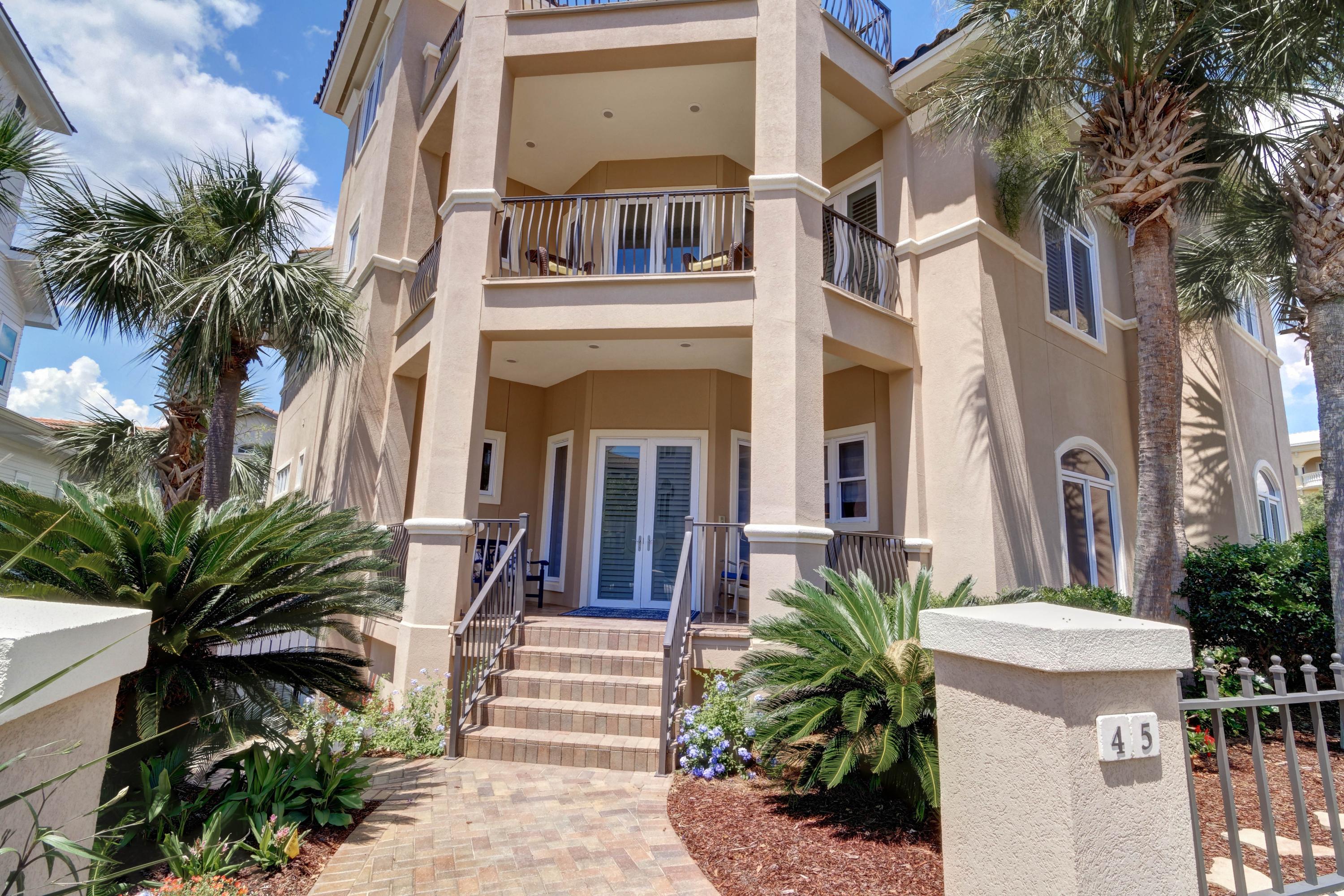GREAT NEW PRICE This meticulously maintained Beach home offers gulf views and is prominently poised on an elevated site just one lot back from the Gulf and short steps to the neighborhood beach access. It's located in coveted Blue Mountain Beach in the gated rental-restricted enclave of the Village of White Cliffs. This intimate neighborhood of just 61 homesites offers wonderful amenities including a beautiful Clubhouse with gathering center, full kitchen, TV Room, fitness center, a seasonally heated pool and lighted tennis court. The neighborhood beach access leading to the private, pristine beach passes a two-story gazebo that affords breathtaking panoramic Gulf views and magnificent sunsets. This property has brick paver walkways, lush landscaping and tall palms offering privacy. A long Graniflex finished driveway with plenty of guest parking leads to a single detached garage and rear courtyard with pavers and fountain.  Off-street parking is also featured throughout the neighborhood.  The home offers 5 bedrooms, 4 ½ baths.  In addition, there are 4 large covered porches/balconies and an open deck on the 3rd floor.  The open floor plan accentuates this property's generous proportions and thoughtful design and is ideal for entertaining.  The kitchen is finely appointed with upgraded appliances, including a 5-burner gas stove, custom cabinetry and beautiful island bar for dining.  Home is equipped with a Life Source Whole House Water Filtration System supplying filtered water to the entire house.  The spacious  great room/dining area with high ceiling, crown molding and  custom columns , easily accommodates a grand piano and is duly appointed with a built-in wet bar with ice maker, wine cooler, sink and custom cabinetry with glass doors, a cozy gas fireplace flanked by custom shelving and cabinets and a wall of windows and tall doors for natural lighting and easy access to the covered balcony.  A guest suite with private bath and a large laundry room with loads of built-ins plus a half bath is also located on this first level.  Take the staircase or the 46" x 36" elevator to the second level where you will find warm wood floors thru-out. The Master suite has plenty of natural light with plantation shutters, a spa-like bath with large closet, walk-in shower, Sanijet tub, his and her vanities and a lovely sitting room opening to a covered South facing balcony.... perfect for your morning coffee or for enjoying cool Gulf breezes.  Additionally, there are three generous guest rooms also with plantation shutters.  One with vaulted wood ceiling, a Murphy bed and built-ins.  A second guest bedroom which is currently being used as an office, has a Murphy bed and built in cabinets and shelving.  It has a large window and doors opening to the rear balcony.  The 3rd guest bedroom with a private bath also opens to the rear balcony overlooking the beautifully landscaped backyard.  The third level features a loft room with wet bar and refrigerator and opens to a large open deck with views of the emerald green waters and lovely surroundings.  With plenty of room for family and guests to gather together, and the gorgeous beach just a few steps away plus the wonderful amenities and Clubhouse, this is the ideal beach home in such a quiet setting yet just minutes away from the dining, shops, 20 miles of bike and jogging trails and all the things that Scenic Hwy 30A so special.  The owners have enjoyed this warm and versatile home for 17 years.  Their children, grandchildren and friends have spent countless hours, days and nights here and have felt so at home in this inviting and friendly neighborhood.