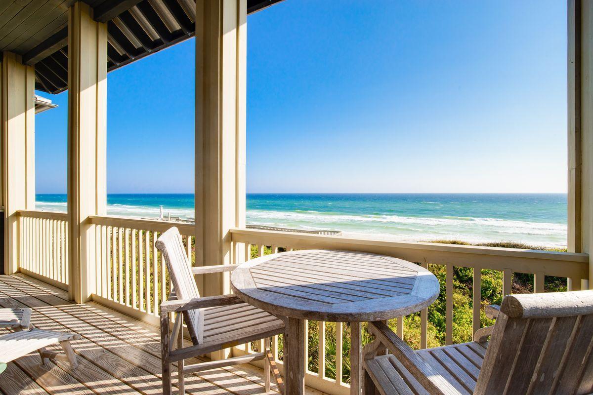 This beachfront cottage has spectacular views of the beach and Gulf with 34 feet of premium Gulf frontage on the less-crowded eastern end of Rosemary Beach. It is fully furnished and move-in or rental ready. Constructed at an elevation of over 30 feet above sea level. The home features an extremely energy-efficient and quiet geothermal HVAC heating and cooling system. The first floor has 10' ceilings with two master suites, each with mahogany French doors connecting to an open Gulf-facing porch. The second story has a high vaulted ceiling and opens to fabulous Gulf views in the family room and dining area through three sets of mahogany French doors and a porch the full width of the home. e site has space to add a carriage house or garage and is ripe for renovating or entirely rebuilding. It is a quick walk to the Coquina Pool and within easy walking or biking distance to all the Rosemary Beach amenities such as tennis courts, fitness center, owners pool, four community pools, parks, and the town center.