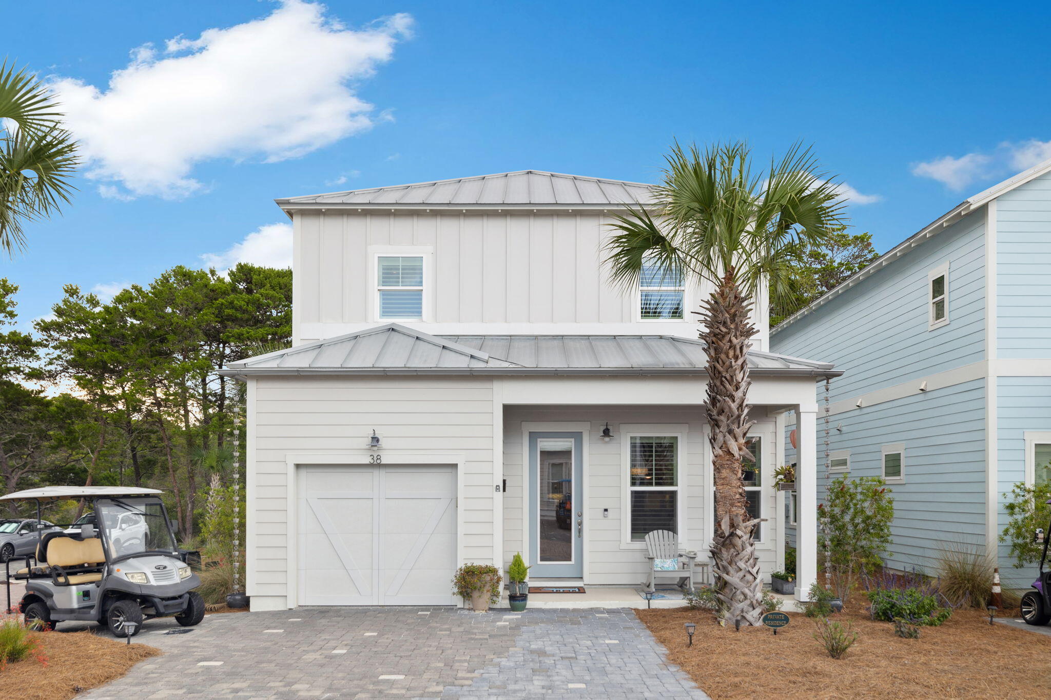ELEVATOR + PAID IN FULL SOLAR SYSTEM. Nestled on a corner lot, 38 Constant Ave offers the ideal blend of luxury, comfort, and location, just moments from the sugar-white sands of Dune Allen Beach. This 4-bedroom, 3.5-bathroom home is perfectly situated to offer both privacy and easy access to the best of 30A. Inside, the open-concept main level is ideal for entertaining, featuring a chef's kitchen with quartz countertops, ample cabinetry, and generous counter space. The kitchen flows into the spacious and airy family room and offers direct access to a serene outdoor patio-perfect for gatherings or quiet relaxation.

The home offers two primary suites, with one located on the first floor for added convenience. A residential ELEVATOR provides easy access to the second floor, where you'll find three additional bedrooms, two full bathrooms, and a screened-in, covered second-level patio overlooking the natural surroundings, an ideal place to enjoy quiet mornings or evening breezes. A standout feature of this property is the PAID IN FULL SOLAR SYSTEM, complete with battery storage. This system currently supplies approximately 50% of the home's annual energy needs, based on the past year. Even more impressive, the solar setup acts as a backup electrical system, meaning if the grid goes down, your power stays on. No need to worry about electrical outages; this home is designed for both sustainability and peace of mind. Additional features include a 1.5-car garage with golf cart entry, a fenced backyard, durable hardboard siding, and a sleek standing seam metal roof for long-lasting coastal appeal. An Electric Street Vehicle (ESV) is also INCLUDED with the sale, offering a fun and effortless way to reach the beach, community pool, nearby shops, and dining. Enjoy unbeatable access to area amenities: just a short walk to the community pool and a quick five-minute ESV or bike ride to the new Dune Allen Regional Beach Access, complete with bathrooms and convenient parking. Live the ultimate 30A lifestyle, with boutique shopping, upscale dining, and scenic bike paths all just around the corner. Whether you're looking for a full-time home, second getaway, or investment opportunity, this one checks all the boxes.