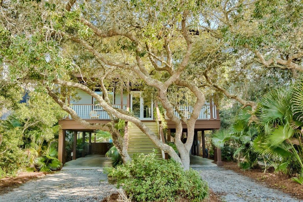 ''Absolutely Grayton'' is a 5 BR/4.5 BA classic Beach House nestled in a canopy of oaks in one of 30A's most charming and sought after historic coastal villages. This is the perfect primary residence or 2nd home vacation destination that generates solid rental income. Short stroll to the undisputed/public white, sandy beaches, Western Lake-area's premier coastal dune lake sanctuary and iconic eateries such as Red Bar, Chiringo, A.J.'s and Borago. Thoughtful design incorporates the beauty of nature with plenty of outdoor space for entertaining, including open and screened porches overlooking a large private pool and sun deck in sizable, fenced rear yard. Covered parking/patio area under house also allows for perfect recreation/play space when not on the Beach or Western Lake. Custom interior features 10' ceilings, hardwood flooring, recessed lighting, crown molding, custom cabinets & tile throughout. Sold furnished except for artwork and some personal items that may be negotiable. $85,259 gross rents on books so far in 2020 as of date of listing, including some owner use and several weeks missed early Spring due to Covid.
