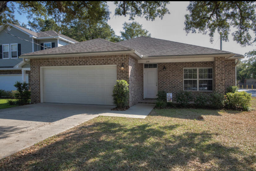 New construction in Niceville featuring quartz countertops, LVP flooring, crown moulding, brick or stone accents with low maintenance vinyl siding. Fenced backyard with sprinkler system and lush landscaping.