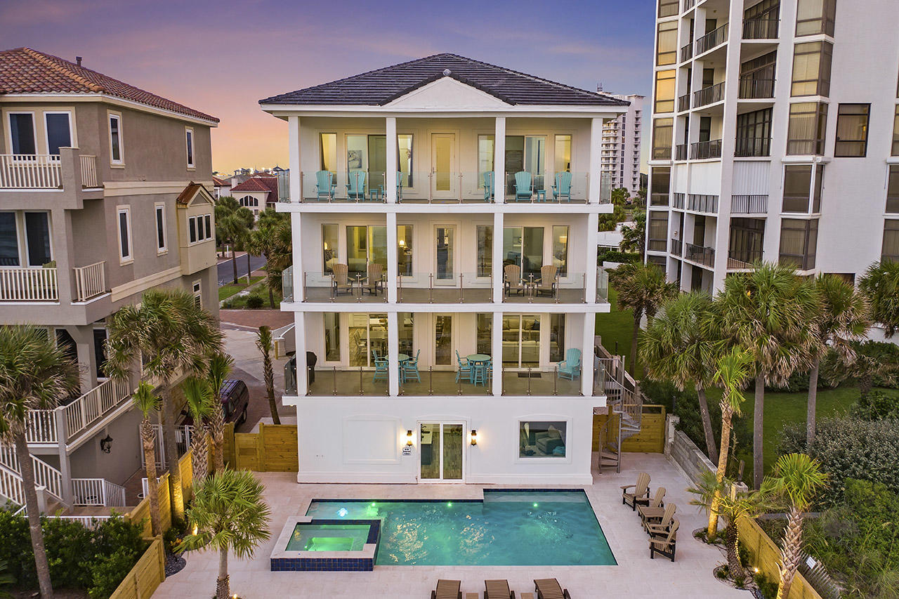 When the owners of this spectacular Gulf front retreat named if after one of Jimmy Buffett's songs, ''Semi True Story,'' they were locking on to one of the best lines of the song, as this house runs all the way to the sea. From its recent and complete renovation to its Gulf front pool and spa, Semi True Story is a true Gulf front masterpiece. It boasts over $570,000 in gross revenue YTD for 2021 and over $600,000 for 2022. It features a new roof, stucco cladding, new windows & doors, new HVAC, flooring, kitchen and baths and a one of a kind custom built bunkroom suite that accommodates more than 12 guests. Sitting directly on the Gulf in the gated community of Dunes of Destin, Semi True Story affords breathtaking views of the water... with a private Gulf front heated pool & spa and private beach access.

The main floor features the living area of the home, complete with an elevator for easy access to all floors; and the sliding glass doors in the living room lead out to a balcony overlooking the Gulf, with seamless glass railings that offer an unobstructed view of the Gulf and spiral staircase that leads down to the pool deck. 

Beautiful white walls, updated finishes, LVP floors, exposed beams, and pecky cypress ceilings create a clean and modern atmosphere; and the open floorplan of the main floor is perfect for the family to be together while eating meals or relaxing in the living room. The extravagant kitchen features floating shelves; brand new, top-of-the-line commercial appliances including two dishwashers; and a spacious pantry. Much like the rest of the house, the dining area is perfectly situated for allowing beautiful views while gathering around the large dining table. 

Offering a perfect sanctuary space, the third floor features a common area with a bar complete with floating shelves, a mini-fridge, and a coffee and wine area with a bar table. Two gulf-front bedrooms, each with a private bath and a walk-in closet, are located on this floor. The master suite boasts beautiful Gulf views with private access to the balcony. The private bathroom has been completely upgraded with a large standalone shower, free-standing tub, and a dual-sink vanity. Step onto the balcony where you can see the water through the seamless glass railings while you enjoy a hot cup of coffee in the morning or enjoy a glass of wine in the evening. Next door, the secondary master features a private bathroom with a walk-in shower and private access to the Gulf-front balcony. 

The entire lower floor of the home consists of an enormous bunk room, uniquely configured with three built-in queen-over-queen-over-queen bunk beds, each with individual mounted flat-screen TVs. Two sofas offer seating around a large flat screen TV; and the space also features two bathrooms, each with two standalone custom showers. Just off of the bunk area is a queen bedroom and a laundry room. Step onto the pool deck and splash into some fun in this stunning private pool with a built-in hot tub, or use the private beach access for a day out on the sand! 


The fourth floor is home to four more King suites, perfect for accommodating guests. Each with their own bathrooms, two of the suites are Gulf front while the other two afford views of the Gulf. Semi True Story has been freshly renovated from top to bottom to meet the needs of a variety of buyers, with an entertainer's lifestyle in mind. Splash around in the large private pool and hot tub or relax on any of the balconies and enjoy unobstructed views of the Gulf and make memories that are sure to last a lifetime. This home is located in the gated community of Dunes of Destin and is in close proximity to numerous shopping and dining options in Destin's Harbor district.