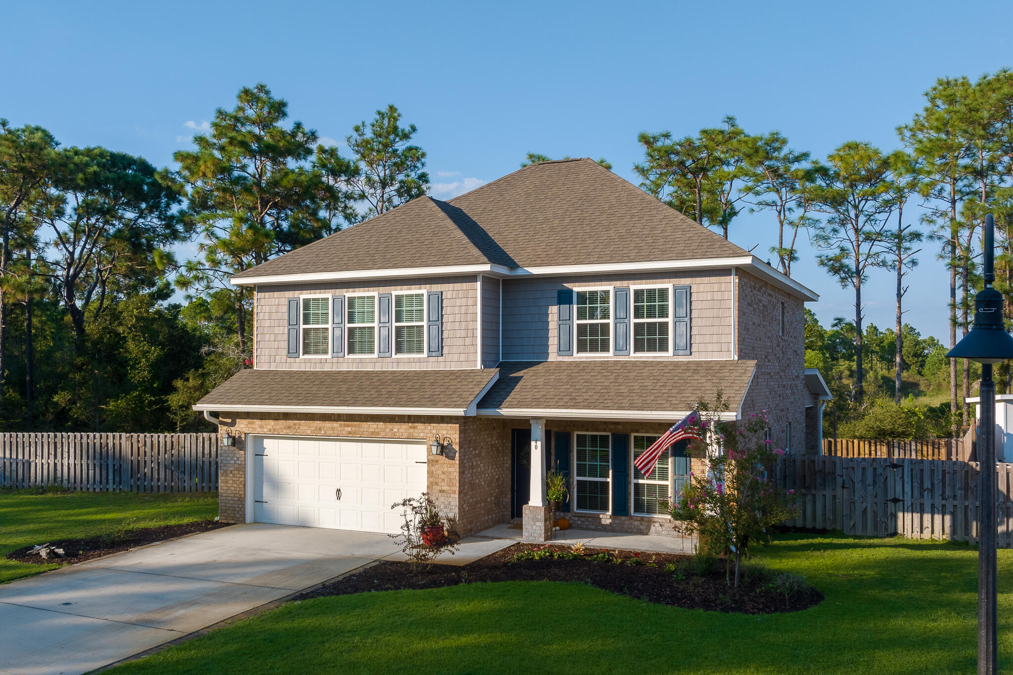 Experience the magic of Emerald Coast living in this spacious home in the popular Peach Creek subdivision. This charming neighborhood is minutes from 30A's sugar-sand beaches, restaurants, shopping, and is only 5 miles from iconic Seaside! The residents of Peach Creek are known for spreading holiday cheer and food trucks often visit this friendly neighborhood. Head to the beach, bike/walk the neighborhood, or enjoy the large back yard. This ''Azalea'' open floor plan features 4 bedrooms, 3.5 baths, and a large bonus room upstairs that is perfect for a second living area, movie/game room, or playroom. The kitchen features a breakfast bar, granite countertops, beautiful cabinetry, tile backsplash, and stainless steel appliances. The large first-floor master suite has tons of natural light, a large walk-in closet, and an en suite featuring a double vanity with granite countertops, spacious tile shower with bench, and linen closet. The first floor also has an under-stairs storage closet and half bath for guests. Upstairs there are three generously-sized guest bedrooms with walk-in closets, a large bonus room, and a dedicated laundry room. Two of the bedrooms share a Jack and Jill bathroom with double vanity and shower/tub combo. The additional guest bedroom has a full bathroom with shower/tub combo just off the hallway. There is more space than you will ever need! Additional features include crown molding, wood flooring in downstairs living area, and upstairs laundry room. The backyard is fenced for privacy with three gates and room for boat storage! There is also room for a pool and sellers have added a hot tub outlet and upgraded electrical for a hot tub (3K value)! The exterior also features a large two-car garage, full irrigation system with brand new pump and Rid-O-Rust system, keypad lock, doorbell camera, and gutters. Schedule a tour today! Photos with furniture have been virtually staged.