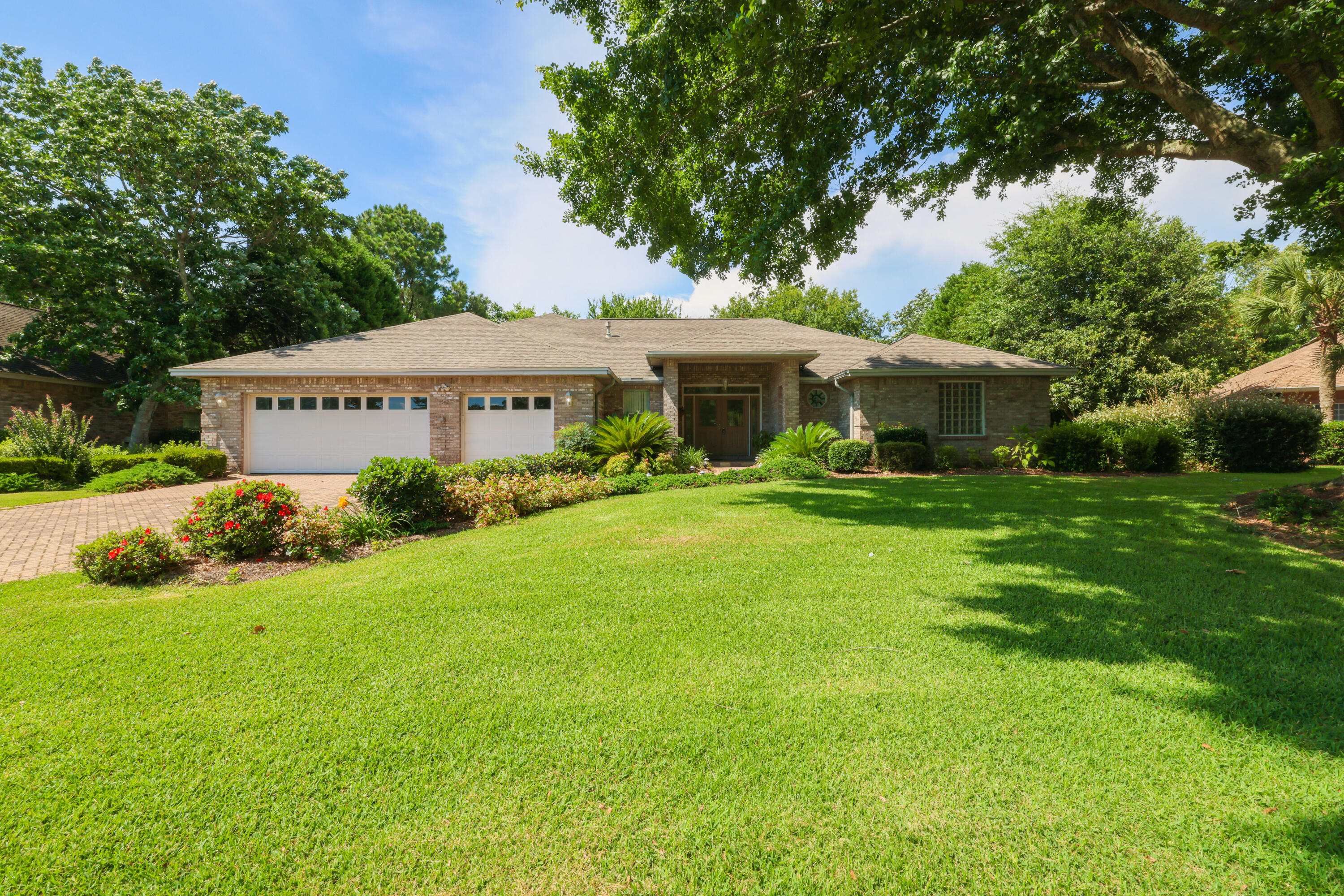 Welcome to your dream home in highly sought-after Glenlake in Bluewater Bay! If you're looking for space, class, and comfort, look no further. This 4 bedroom, 3 bath home boasts over 3600 sq ft of living space and rests on a well-manicured lot. From the moment you pull onto the paver driveway and notice the 3-car garage, you'll know you've come to the right place. Step inside and you'll notice a large sitting area that's perfect for reading your favorite book as you glance out to your large covered back patio. The master suite features a large bedroom, double vanity, a walk-in shower with separate garden tub, and an oversized walk-in closet. The living room is designed with the entertainer in mind with its size, openness, and natural light. Two additional bedrooms and a full bath on the main floor offers plenty of rest for a large family and/or guests. Upstairs features its own private suite complete with a full bath, perfect for visitors, a growing family, or as an in-law suite. You don't want to miss this one, it won't last long. Book your appointment today!
