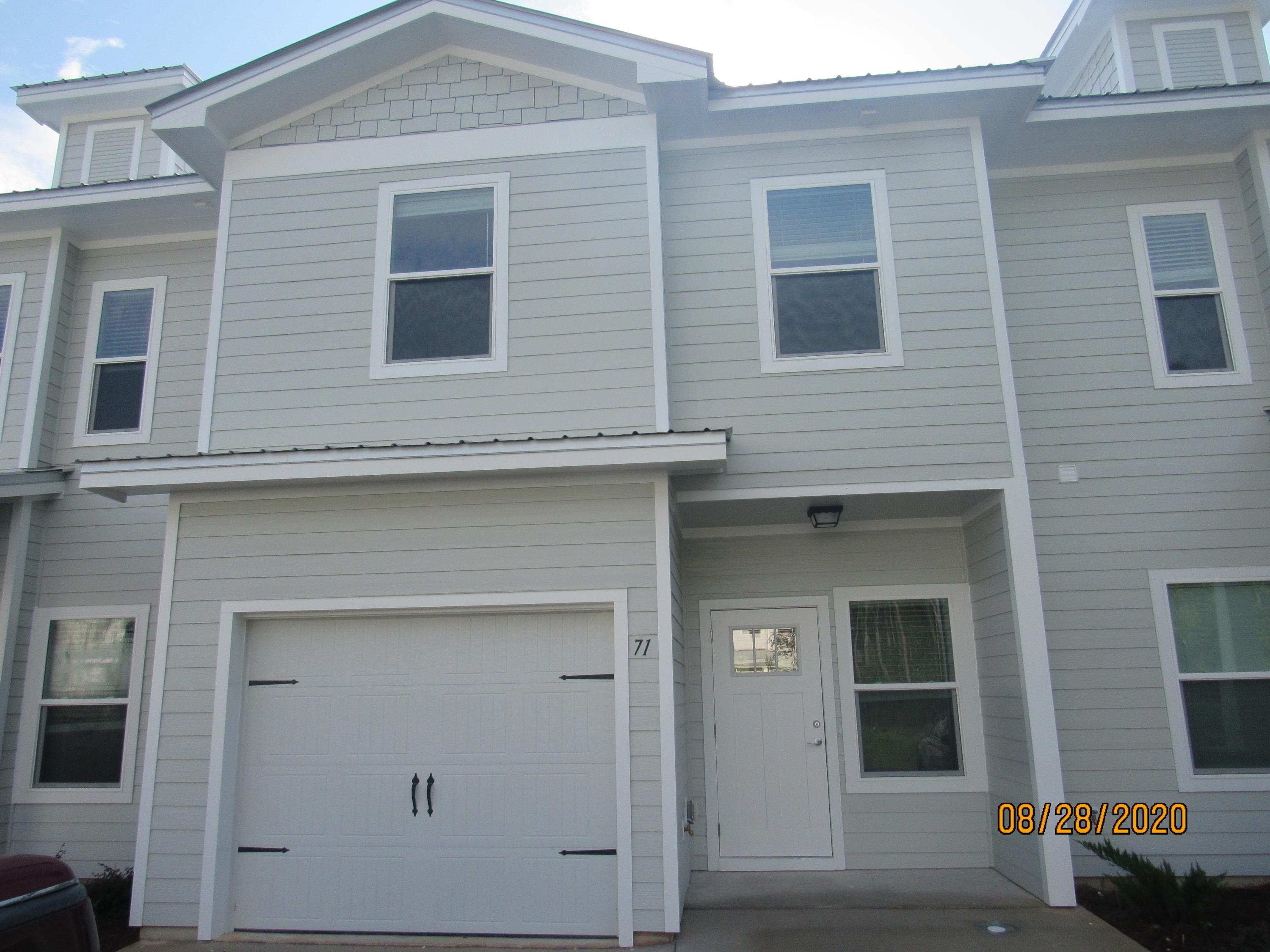3 bedroom, 2.5 bath town home with upgrades, ***garage,*** and a community pool! This lovely home is across the street from an elementary school, just down the road from a Publix shopping center, and a short, easy commute to the sugar sand beaches and emerald waters of 30a/SOWAL. It has fresh, neutral paint and no carpet throughout. The open floor plan on the first level includes a nice size living room with nook, eat-in kitchen with breakfast bar, gorgeous counter tops, plenty of counter/cabinet space, stainless appliances (including a flat cook top stove), beautiful back splash, and pantry as well as a half guest bath with pedestal sink and a screened-in back porch. Upstairs, you will find the master bedroom, complete with a walk-in closet and en suite with double vanity, soaking tub, and separate walk-in shower, as well as two guest rooms sharing a full guest bath and the laundry hookups (washer and dryer included in rental). There is plenty of storage. Pool care, lawn care, and garbage included in the rent. Pets may be considered on a case-by-case basis with prior owner approval and a non-refundable pet fee. NO SMOKING.