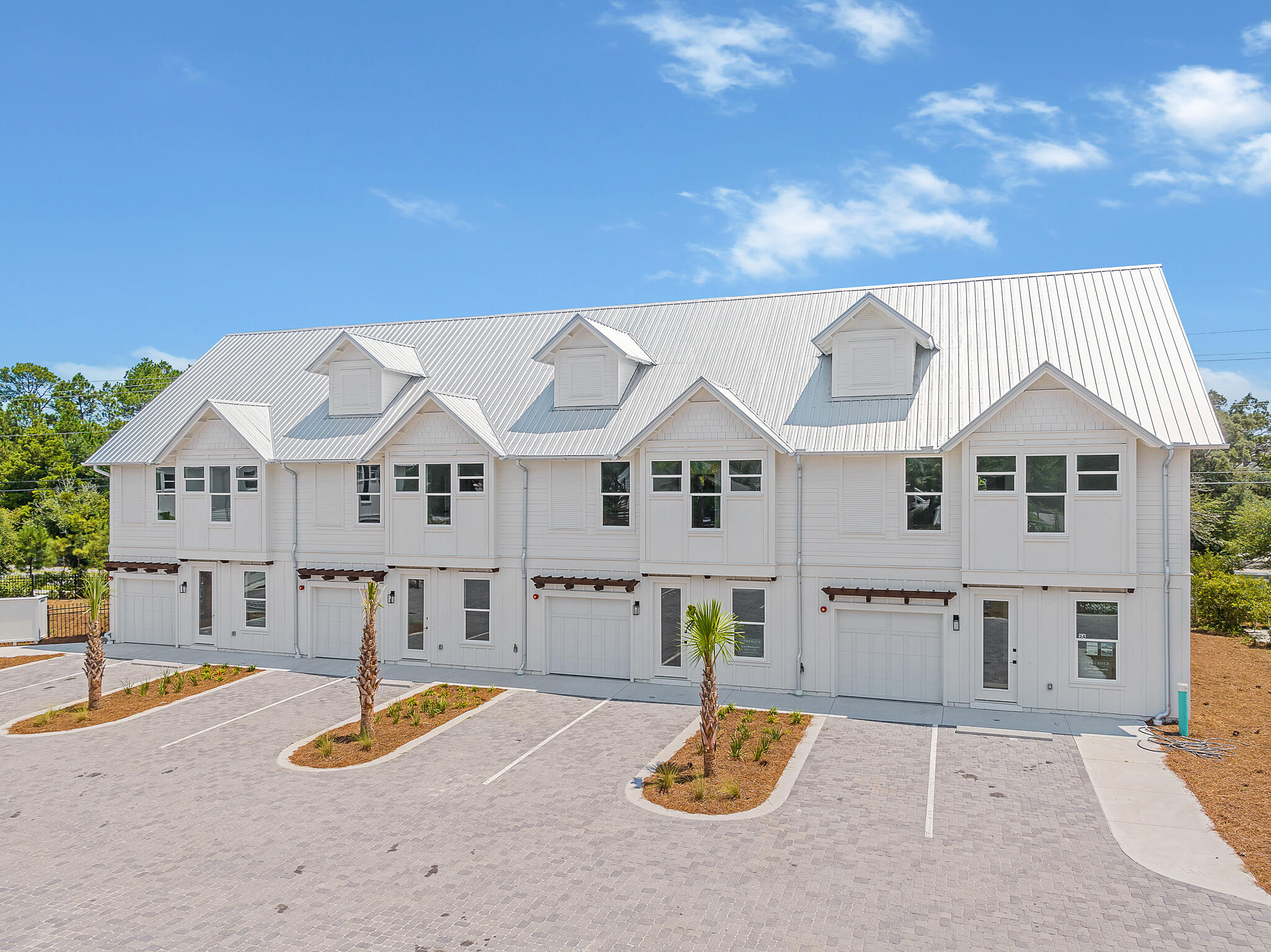 Welcome to the epitome of coastal living! This newly finished construction townhome is a gem nestled within a small boutique community of just 7 units. Boasting 3 spacious bedrooms, 3 and 1/2 baths, additional bunk room area and 1,935 square feet of heated/cooled living space, this residence offers a perfect blend of style and functionality. Inside, you'll be greeted by beautiful hardwood flooring, sleek quartz countertops, and charming wood accent walls that create an inviting atmosphere. The highlight of this home is the covered 3rd-floor outdoor living area, where you can unwind while taking in the serene surroundings. Situated in the tranquil Blue Mountain Beach area, this property offers a respite from the crowds, yet it's conveniently close to Gulf Place, a vibrant hub with fantastic restaurants, shops, an art district, and additional beach access. For those seeking beach days, GulfView Heights provides easy access, and when you're not at the beach, you can relax by the private community pool. Commuting is a breeze with easy access to Highway 98 via Highway 393 and 283. Don't miss out on this coastal haven - schedule your viewing today!