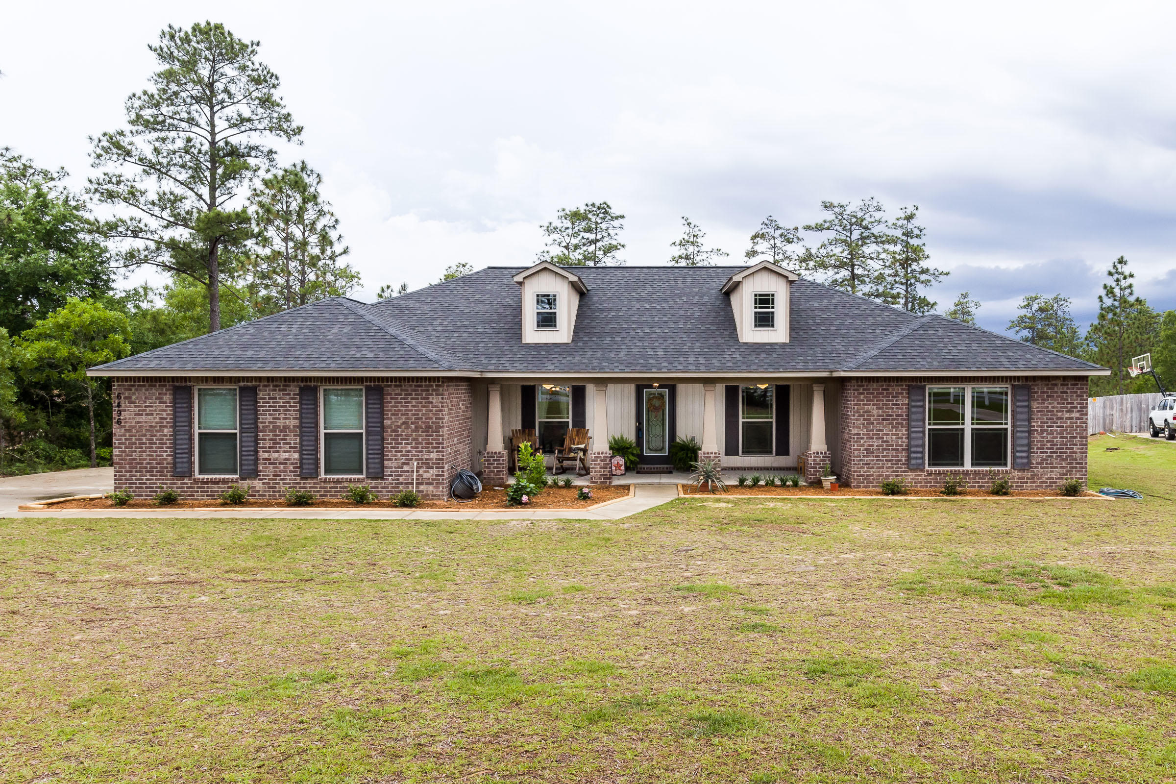 No need to wait for a new build to be completed, this one has it all and is ready for you NOW! This beautiful home was built in 2016 and sits on a private 1 acre lot, accented on the front with a white picket fence. Yellow River Plantation delivers the perfect blend of country life + neighborhood amenities, with trails, 2 stocked fishing ponds, and a playground for the little ones. The floorplan is so versatile, with 4 generous sized bedrooms, a formal dining room, and an office. The kitchen features granite countertops, great counter space, and a hop up bar for additional seating. The master bathroom has been updated with a tile shower and has dual walk in closets. The living space has been updated with beautiful wood flooring. Beautiful home!