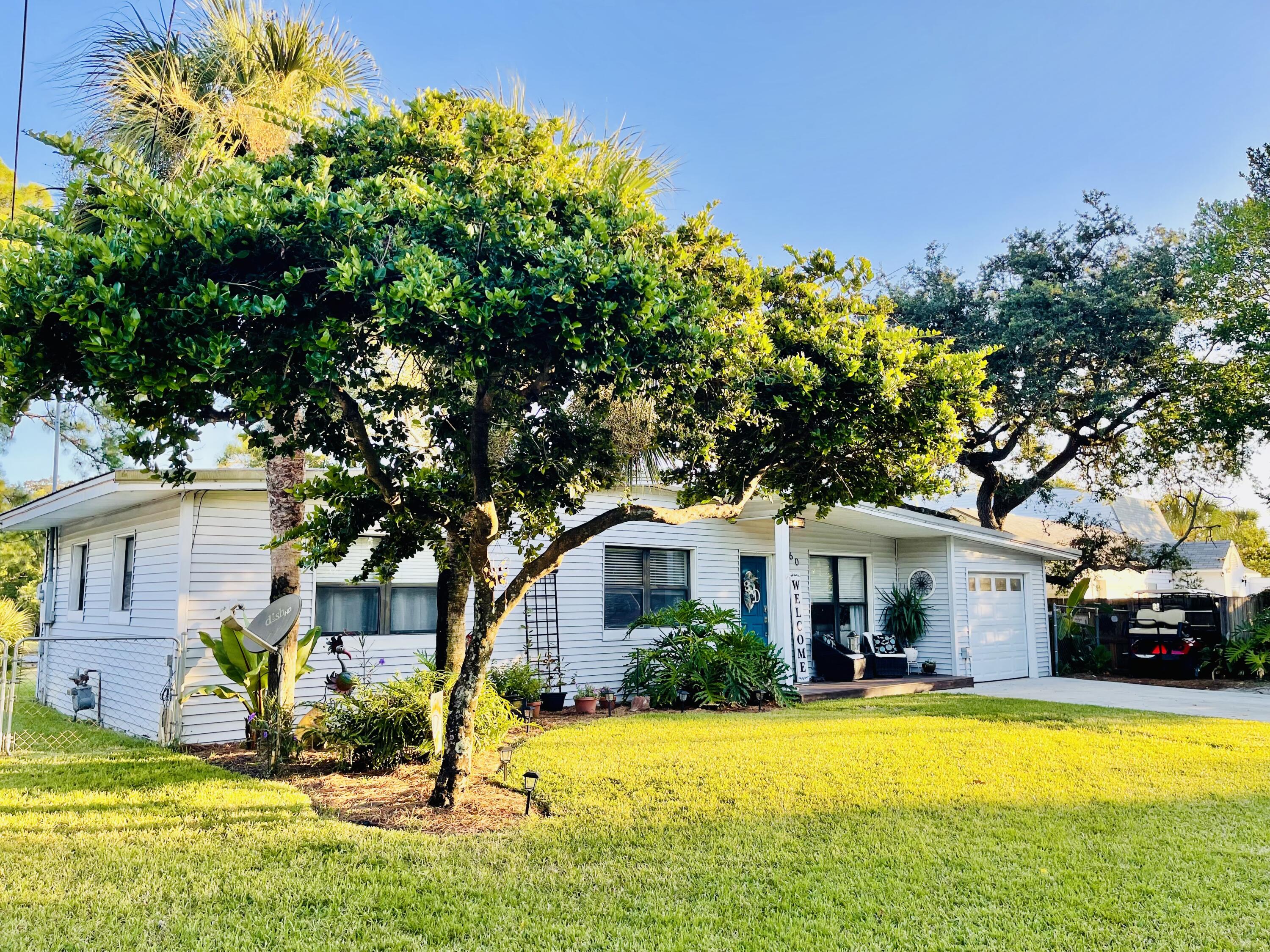 Hop, skip and a jump from Crab Island!  This 3 bedroom, 1 bath, direct waterfront totally remodeled home is ready for you!  Located in the highly desired, golf-cart neighborhood of Elliott Point on a little over a 1/3 of an acre.  Numerous shops, restaurants, and entertainment a fun golf cart ride away.  Dedicated golf cart parking space too. Top of the street is Ferry Park where you can enjoy nice walks on the paved, lit 1 mile trail, or exercise at the stations along the trail, play a round of frisbee golf, basketball, tennis and more!  The sellers are ready to sell at the right price and have lovingly made every update in the 20 years that they have lived here.  Perfect primary residence, vacation home or rental investment!  Call now for your private showing or more details. Brand new kitchen put in this year!  Stunning outdoor shower in the lush, tropical courtyard.  Freshly painted, new deck too!  RV hookup with 30AMP service and cleanout available, so bring your RV.  This home has it all!