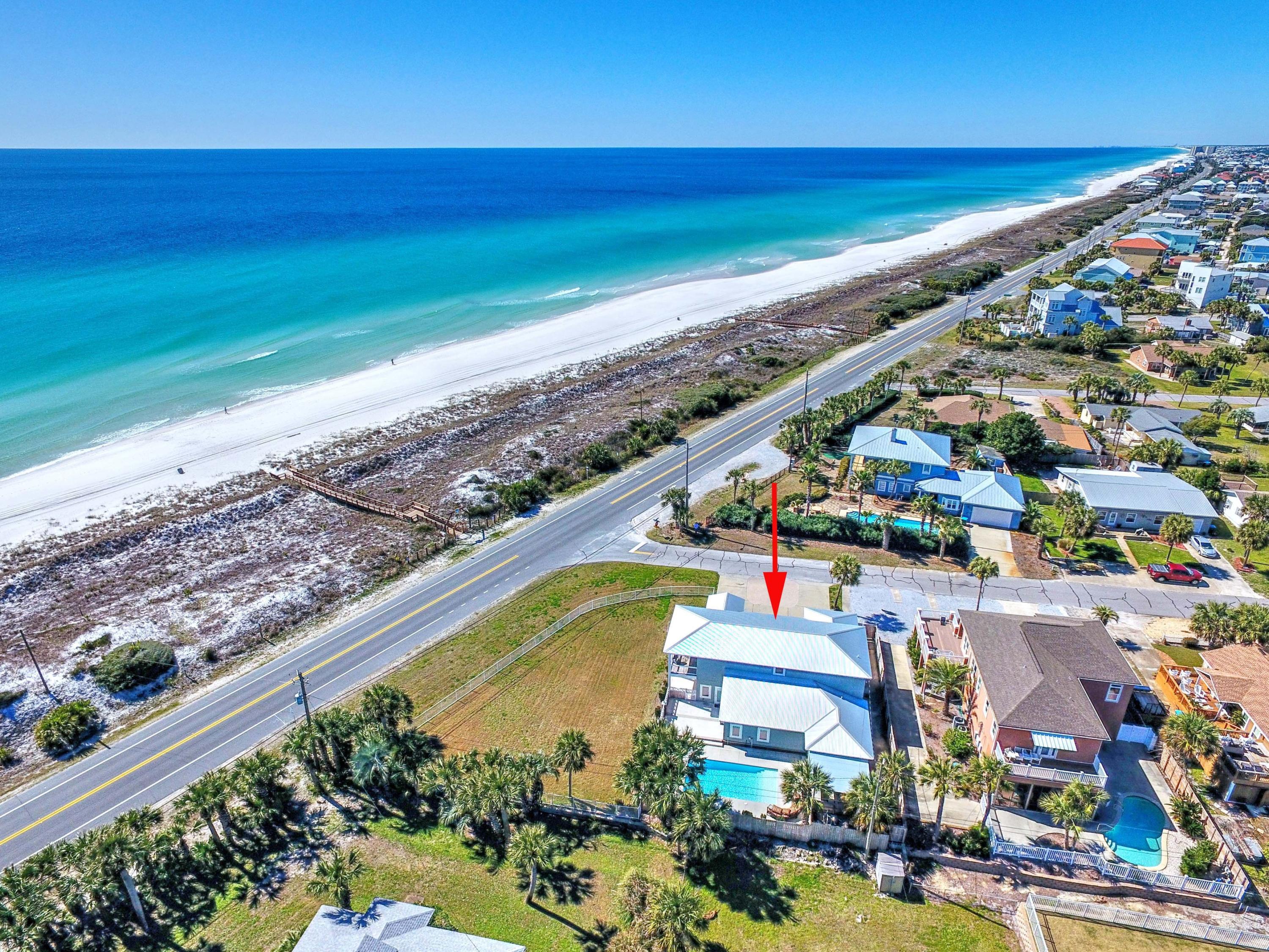 Exceptional investment opportunity! Located at the popular West end of Panama City Beach, this home is directly across the street from the private Santa Monica Beach access. It is perfectly positioned on an elevated, fenced, corner site to capture unobstructed, , panoramic views of the Gulf. There is impressive outdoor living space that is perfect for wedding venues or family yard games with plenty of room to add a two car garage with carriage house. A large gas-heated pool is surrounded by flickering lanterns, plenty of decking, an outside bar and covered dining and grilling area.
This Coastal contemporary masterpiece spans over 3,500 sq. ft. and sleeps 19! It was built from the ground up in 2015. The open floor plan accentuates this property's generous proportions and thoughtful design. As you enter the home you will be wowed by the raised ceiling and spaciousness of the main living/dining area. It is light and open with plenty of seating area, custom built entertainment center, and a wall of tall French glass doors showcasing the stunning Gulf views.
All five oversized bedrooms with 4 1/2 baths are on the first level. The bunk room with 6 bunks measures 21' 10' x 10' 9.6"!
The open kitchen features tall cabinets, quartz countertops, a 14' island bar, upgraded Stainless Steel appliances including a gas range, NG stove, and Samsung Hub Wi FI Refrigerator. The 2nd level loft area offers guests conversation and entertainment areas, a full bath and access to a large covered balcony for incredible sunsets and uncompromising Gulf and Western oriented views.
This prime location provides a quiet, and relaxing beach lifestyle while being just a short drive away from Scenic Hwy 30A with award winning restaurants, art galleries, entertainment and 20 miles of biking and jogging trails. In addition, Pier Park is five minutes away with hundreds of shops, dining, movie theater and entertainment. This home is being sold 'rental ready' with a history of strong rental income.