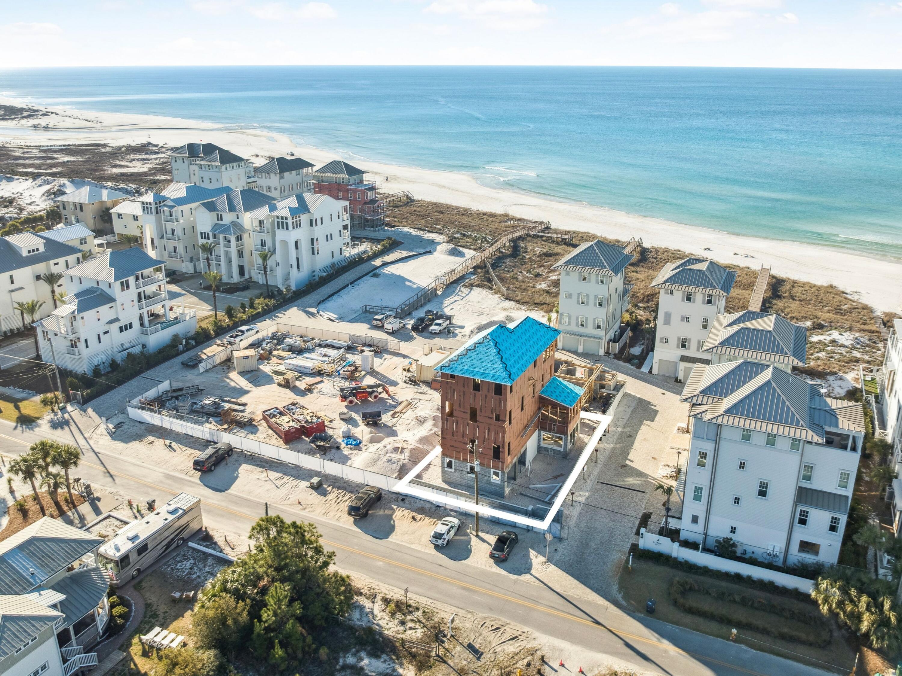 Property is under contract with a 72 hour kick-out clause. Tucked within the intimate, architecturally curated enclave of Lupin Beach, Lot 10 introduces a rare opportunity to experience the peaceful side of Inlet Beach--where elegant design, quiet surroundings, and thoughtful craftsmanship come together just moments from the most celebrated destinations along Scenic 30A. Designed by the esteemed team at Historical Concepts, this boutique Gulf-front community offers a refreshing alternative to the more dense locations of Rosemary and Alys Beach, while delivering effortless access to both. Spanning 3,110 square feet across four refined levels, the home is composed with a calming, sanctuary-like sensibility. Soft, creamy tones, warm neutral textures, and elevated detailing define its interiors, creating an atmosphere that feels serene, airy, and deeply restorative. Natural light moves gracefully through each level, enhancing a layout that blends generous gathering spaces with private areas for reprieve.

The home's defining architectural moment is the expansive top floor terrace, a breezy elevated retreat designed for quiet mornings, glowing sunsets, and intimate evenings above the coast. Paired with a family room and wet bar, this level serves as a private oasisideal for unwinding, entertaining, or simply savoring the rhythm of Gulf breezes.

Across its multiple floors, the residence offers extraordinary flexibility for full-time homeowners, second-home seekers, and multigenerational families alike. Two main living areas provide separation and comfort, while four bedrooms plus a bunk roomeach supported by full or half bathsensure ample accommodation for guests. An elevator serving all levels enhances accessibility and ease, making daily living both convenient and intuitive.

The ground floor is purpose-built for coastal life, featuring a covered outdoor living area, changing room, shower, and an oversized two-car garage,an ideal transition from beach days to home. Upper levels reveal refined living and dining spaces, a tranquil primary suite with private sitting area and terrace access, additional ensuite bedrooms, and thoughtful storage throughout.

Lot 10 also enjoys one of the most enviable locations along the eastern edge of 30A. Steps away, Lake Powell, one of Florida's most iconic coastal dune lakes, invites paddleboarding, kayaking, and quiet exploration. Immediately to the east, Camp Helen State Park offers preserved natural beauty, hiking trails, a fishing pier, and abundant wildlife. And within a short walk or bike ride, the world-class dining, boutiques, and cultural experiences of Rosemary Beach, Alys Beach, Seacrest, and Kaiya Beach Resort await.

For recreation and club amenities, owners benefit from close proximity to Watersound Beach Club, the expansive new Camp Creek amenities, and Wild Heron Golf Clubeach offering resort-style pools, golf, tennis, pickleball, fitness facilities, and multiple dining venues. Travel is effortless with Northwest Florida Beaches International Airport just 15-20 minutes away, providing direct connections to major Southeastern and national markets.

Balancing privacy with proximity, design with livability, and calmness with coastal vibrancy, Lot 10 at Lupin Beach stands as a rare sanctuary on the eastern edge of 30Acrafted with intention, shaped by architectural pedigree, and ready to welcome its first owner into a life of peaceful, boutique coastal living.