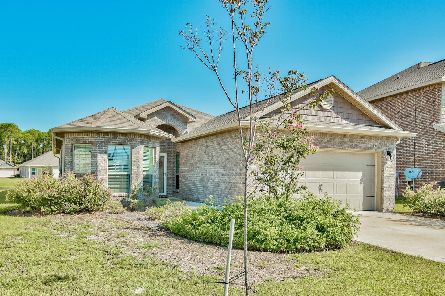 Gorgeous 'Like New' home located in Driftwood Estates. This 4 bedroom, 2 bath sits on a premier water front lot with 50 ft of frontage. As you enter the home it features a very open floor-plan with beautiful hardwood floors in the main living areas with carpet in the bedrooms and tile in baths. Beautiful cabinetry with stainless steel appliances and granite counter-tops. The family room is central to the home and opens to both the breakfast area, dining room and kitchen. The master bedroom is very spacious and faces the back of the home. The M/bath features dual sinks, a large walk-in closet, separate tub and shower. The laundry room is large and and features a shelf and kitchen pantry. Laundry room is located off the garage and opens into the kitchen. Great screened porch for relaxing and enjoying the pond views. Home features many upgrades with custom made window treatments and plantation shutters, sprinkler system, rain gutters and screened in porch. Driftwood offers a community pool, tennis courts, fishing pier, playground, grilling station with gazebo, sidewalks throughout the community and more! All data and dimensions to be verified by the buyer. Seller to pay Title and closing to take place at Rodgers-Keifer Title.
