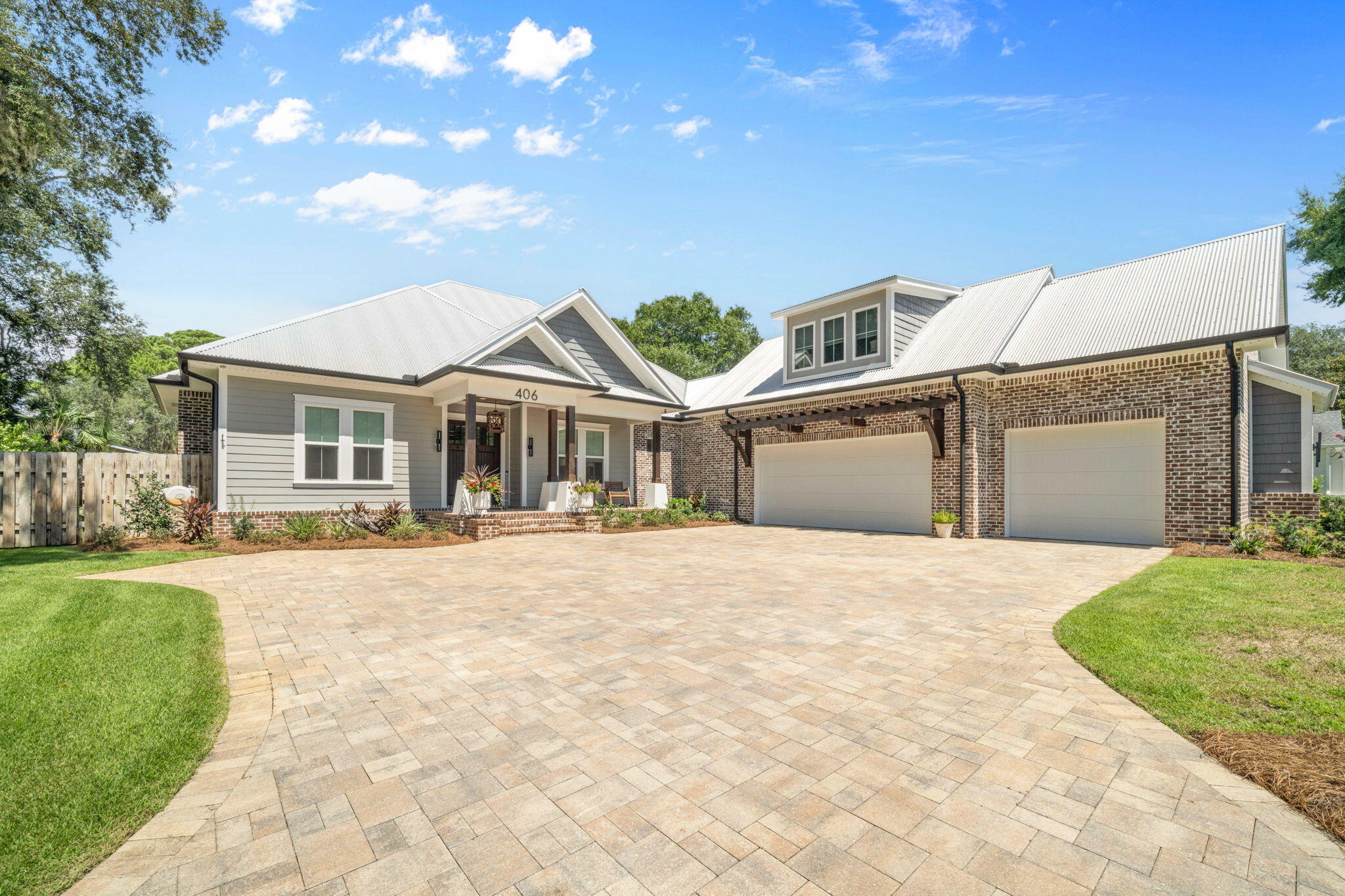 LOCATION, LOCATION, LOCATION!
Welcome to 406 Bay Oaks Court - a rare gem in the heart of beautiful Destin, Florida. Nestled on a quiet cul-de-sac in Old Destin, just steps from Choctawhatchee Bay, this 2019 custom-built craftsman estate delivers the perfect blend of luxury, comfort, and thoughtful design.
From the moment you step through the custom mahogany front door, you'll be captivated by the spacious, open-concept floor plan and the impeccable architectural details throughout. This 4-bedroom, 4-bathroom home also features a dedicated home office (easily used as a 5th bedroom), offering flexible living space! The chef's kitchen is a showstopper, boasting a professional-grade gas stove and oven, custom cabinetry, two built-in refrigerator/freezers, microwave drawer, and an oversized quartz island ideal for entertaining. The living area is equally impressive with coffered ceilings, a gas fireplace, and disappearing glass sliders that open up to your Florida dream lifestyle. The first-floor master suite features a geometric accent wall, dual walk-in closets with custom cabinetry, and a luxurious spa-like bathroom complete with dual shower heads, freestanding soaking tub, and backlit vanity mirrors. The second floor offers a large, private guest suite with its own full bathroom and independent Toshiba mini-split AC system, providing ultimate comfort and privacy. Step outside to your own private paradise. The centerpiece of the backyard is a custom gunite pool with a raised hot tub, surrounded by a pavered lanai perfect for year-round relaxation. Whether you're enjoying a morning swim or an evening soak under the stars, this outdoor space offers resort-style living at its finest. The screened-in porch with cedar tongue-and-groove ceiling, summer kitchen, and second gas fireplace creates the ultimate indoor/outdoor living experience. The backyard is fully fenced, beautifully landscaped, and features automated lighting, a lawn pump, and irrigation system to keep everything lush year-round. Massive 3-car side-entry garage with epoxy-finished showroom floors

Brick-paved driveway and 10' x 20' pavered parking pad with 30 AMP outlet for RV or boat

Metal roof, impact-resistant windows, spray foam insulation, and brick exterior for long-term durability and favorable insurance rates

Generac 22kW whole-house generator for uninterrupted comfort

LOMA-F designation in Flood Zone X

Situated in a private five-home neighborhood, you're within close proximity to Joe's Bayou boat launch, two waterfront parks, and the bustling Destin Harborwalk Village. Convenient to Eglin AFB, Hurlburt Field, top-rated schools, and just minutes from the world's most beautiful beaches.