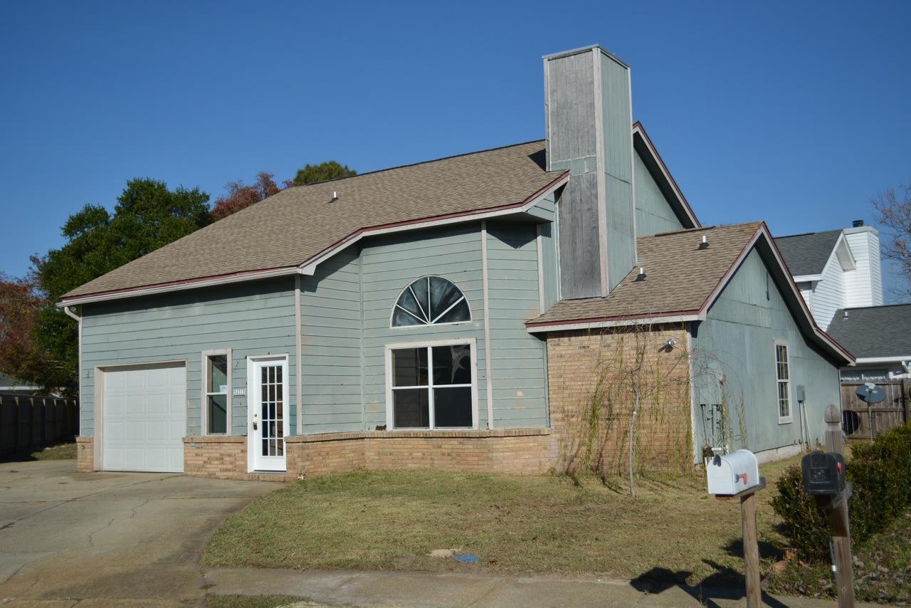 REO. Conveniently located in the central part of town, within walking distance to 3 schools and shopping - also convenient to both Eglin AFB and Hurlburt Field. This home features a Beautiful Brick Fireplace with Soaring Ceilings in the Living Area, Ceramic Tile in the Kitchen, 1st Floor Master Suite and a Large Kitchen. 2 Bedrooms and Full Bath Upstairs in addition to a small loft area.