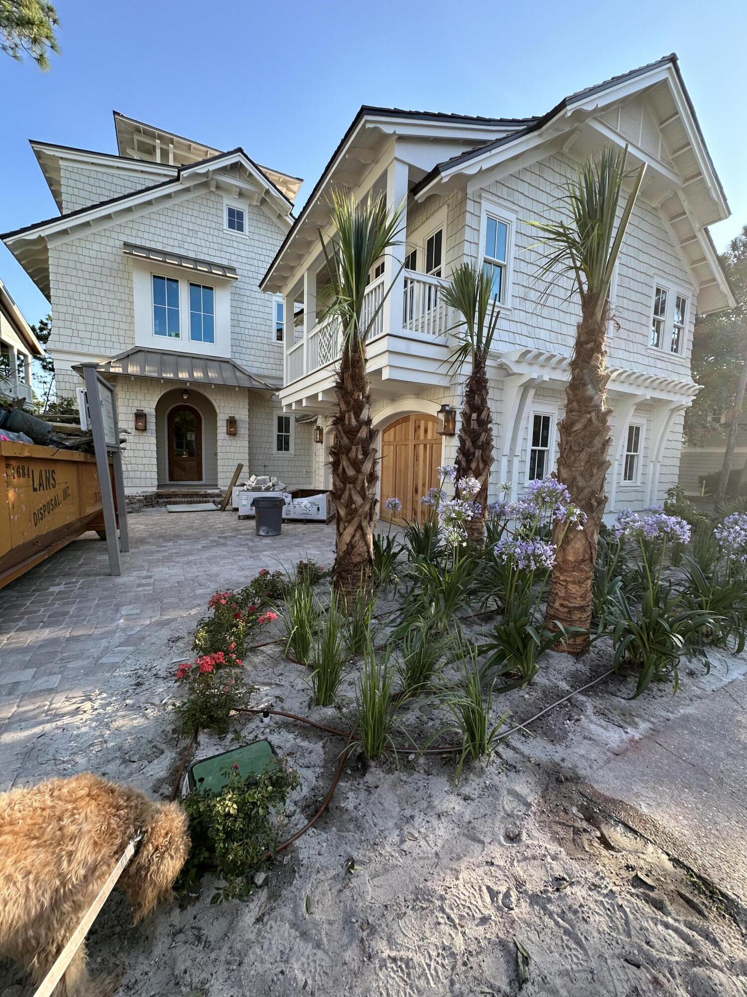 Exquisite new construction in the coveted WaterSound Beach community expertly designed by Gregory D Jazayeri and built by Borges Brooks Builders. Nestled on a prime corner lot overlooking a scenic pond, this majestic three-story residence boasts nearly 4,800 square feet with a 4BR/4.5BA primary home, a 1BR/1BA carriage home, a private heated saltwater swimming pool, a climate-controlled two-car garage, an elevator, and a fourth level tower with sweeping community and gulf views.

Step inside to reveal a meticulous attention to detail throughout and the finest craftsmanship employed to create spaces that are equally stunning and functional. A welcoming foyer leads to the open and spacious living and dining areas highlighted by stone accent arches, cypress ceiling beams, beautiful millwork, and all-white oak floors. The gourmet kitchen includes an adjacent butler's pantry, and these spaces feature custom-built cabinets with designer hardware drawers, a custom white oak island, and a suite of high-end Thermador appliances including a dual fuel range with a double griddle, steam oven, and warming drawer, a built-in coffee maker, a countertop glass washer, two dishwashers, and a Pellet ice maker. The living area opens to a large porch overlooking the pond and pool courtyard with a summer kitchen and an outdoor fireplace. A guest suite with private bathroom, a laundry room and a powder room are also located on the first level.

Upstairs, oak arched doorways lead to both a primary and secondary master suite, each featuring elegant ensuites. The primary master suite offers both a walk-in closet and custom dressing area, a morning bar with under-counter refrigerator, and a spa bathtub with aeration option. Both second level suites provide private access to a large porch overlooking the pond with a fireplace. A second full laundry room is also on this level. On the third level, find an entertainment room, fourth bedroom perfect for a bunk room, and a full bathroom. Follow the staircase from this level to the fourth-floor tower for the most stunning views! The carriage home over the two-car garage easily accommodates guests with a full kitchen, living area, and separate bedroom. This home has been outfitted with the latest in technology with a Control 4 system, multiple WIFI access points, three surveillance cameras, and high-end audio speakers (some invisible) installed throughout both the interior and exterior of the home. Additional upgrades include Frame TVs, plumbing for a whole-home water filtration system, and upgraded insulation on all interior walls and ceilings. This home presents a special opportunity for discerning buyers wishing to purchase a new home without having to do all of the groundwork of a custom build. The thoughtful design lends itself seamlessly to many purposes from a primary residence, personal retreat, or an investment property.

The gated WaterSound Beach community is located south of Scenic Highway 30A offering homeowners a rare sense of seclusion yet with easy access to area activities. Amenities include swimming pools, a puttering park, community green spaces, a state-of-the-art fitness center, and private boardwalks along the rare coastal dune lakes and leading to the beach and to one of the most beautiful stretches of coastline in the country. Owners also have the opportunity to join the Watersound Club by The St. Joe Company featuring: private beach access, beach services, pools, restaurants, a bar with gulf views, two private golf courses (Camp Creek and Sharks Tooth) and the brand new Lifestyle Center at Camp Creek. 

*Co-Listing Agent has equitable interest in the property.