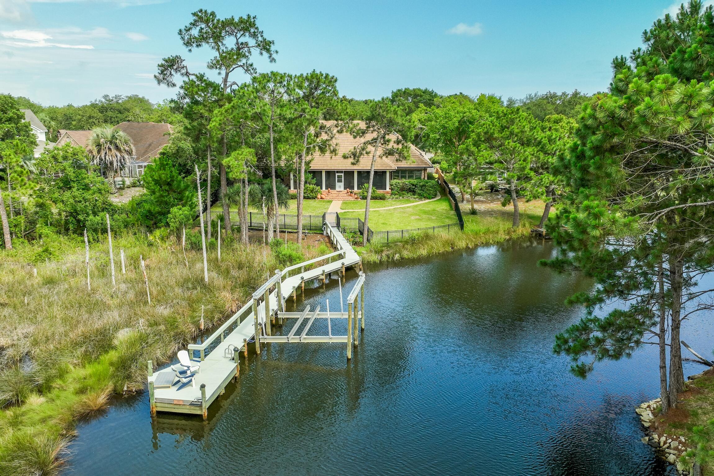 Welcome to your deep water oasis on Indian Bayou! This exquisite 4-bedroom, 3 and a half bathroom home has recently undergone extensive improvements, ensuring a luxurious and well maintained living experience. Starting with the exterior, the property boasts a brand-new concrete tile roof, complete with new gutters and skylights. The AC has been replaced throughout the home, including the addition of a dedicated A/C unit in the garage storage room. No more worrying about power outages thanks to the new 27KW Generac generator, ensuring uninterrupted comfort and convenience. Inside, you'll discover a host of impressive enhancements that include a newly renovated Kitchen and Master Bedroom Suite. Prepare culinary delights in the fully remodeled kitchen, featuring top-of-the-line upgrades such as a new Wolf range, Wolf oven and microwave, and a Bosch dishwasher. The remodeled cabinets, new LED light fixtures, and stunning quartz countertops create an inviting space for both cooking and entertaining. 
Escape to your private sanctuary in the master suite, where you'll find a fully renovated master bathroom. It boasts new tile and paint, a remodeled shower, an enlarged closet with custom California Closets, and new plumbing fixtures. Relax and unwind in the new soaker tub, surrounded by new light fixtures and fresh paint. The master bedroom has been rejuvenated with new paint and automatic blinds, creating a tranquil space to recharge and relax.

The family room has also received a stylish makeover, with new lighting and has been freshly painted. Enjoy the convenience of automatic blinds, allowing you to effortlessly control the natural light streaming in.

Step outside to your personal waterfront retreat. The dock has been upgraded with a new 24k lift, ensuring easy access to your boat or watercraft. The dock support has been replaced, and new lighting, including a fish light, adds to the enchanting ambiance. All electric and water lines have been replaced, guaranteeing seamless functionality. You can walk out to your boat and take a quick ride to the gulf or bay or fish from the back dock!

The exterior of this home is free of deferred maintenance. Its trim has been freshly painted and the porch screens have been replaced to ensure the new owner can enjoy the uninterrupted views and breathtaking surroundings. The new backyard fence offers privacy and security, completing this idyllic waterfront haven.

Don't miss this extraordinary opportunity to own this deep water gem in Indian Bayou. With its impeccable upgrades and picturesque location, this home is truly a slice of paradise. Schedule your private showing today and make your waterfront dreams a reality!