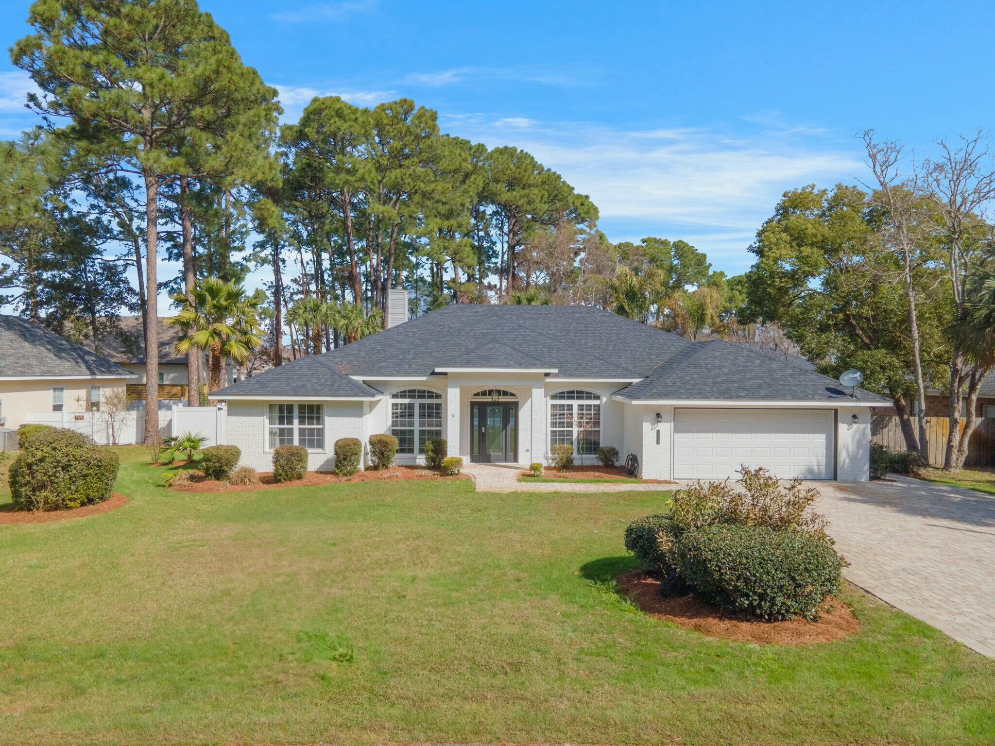 CALLING ALL BOATING ENTHUSIAST!  The oversize driveway allows for ample space to park a boat.  In addition, a public boat launch is located approximately 2 miles east at Legion park.  Rather go the beach?  No problem!  This home comes with a street legal 6 passenger golf cart that can be driven to multiple beach access within 2-3 miles.  Rounding out the triple crown of water amenities, there's a lania that encloses a pool/hot area.  Perfect for relaxing and/or entertaining sizeable groups.  This is a fun home!


 Centrally positioned in the Miramar/Destin area, this stunning 4 Bedroom RANCH style home offers both luxury and convenience.  Whether shopping, dining, boating or heading to the beach, all can be reached within a very short period of time. Four dedicated Bedrooms and three full baths along with an additional bonus room that can be an office (or 5th Bedroom) offers flexible options.  A formal dining room, gourmet kitchen with separate eat-in-bar, spacious laundry and 2 car garage make this single floor home unique.   The spacious master bedroom with views of the outdoor oasis also includes a recently, fully updated master bathroom with dual vanities that showcases the main living quarters.  Hardwood and tile flooring along with crown molding, trayed ceilings and arched doorways present an upscaled, high-crafted feel upon entering the home.  

The white brick exterior with dark gray accents, a new roof and a brick paved driveway showcase this home from the curbside.  A vinyl white-sided fence extends throughout the perimeter of the home adding both privacy and elegance to the property.  

With no HOA restrictions, the opportunity to short term rent opens up this home as a potential investment opportunity boasting an already established book of vacation rentals that has the potential of yielding $94,000 annually (see attached projection).

With close to $100,000 worth of furnishings, updates and added inclusions, this home is a must see!!