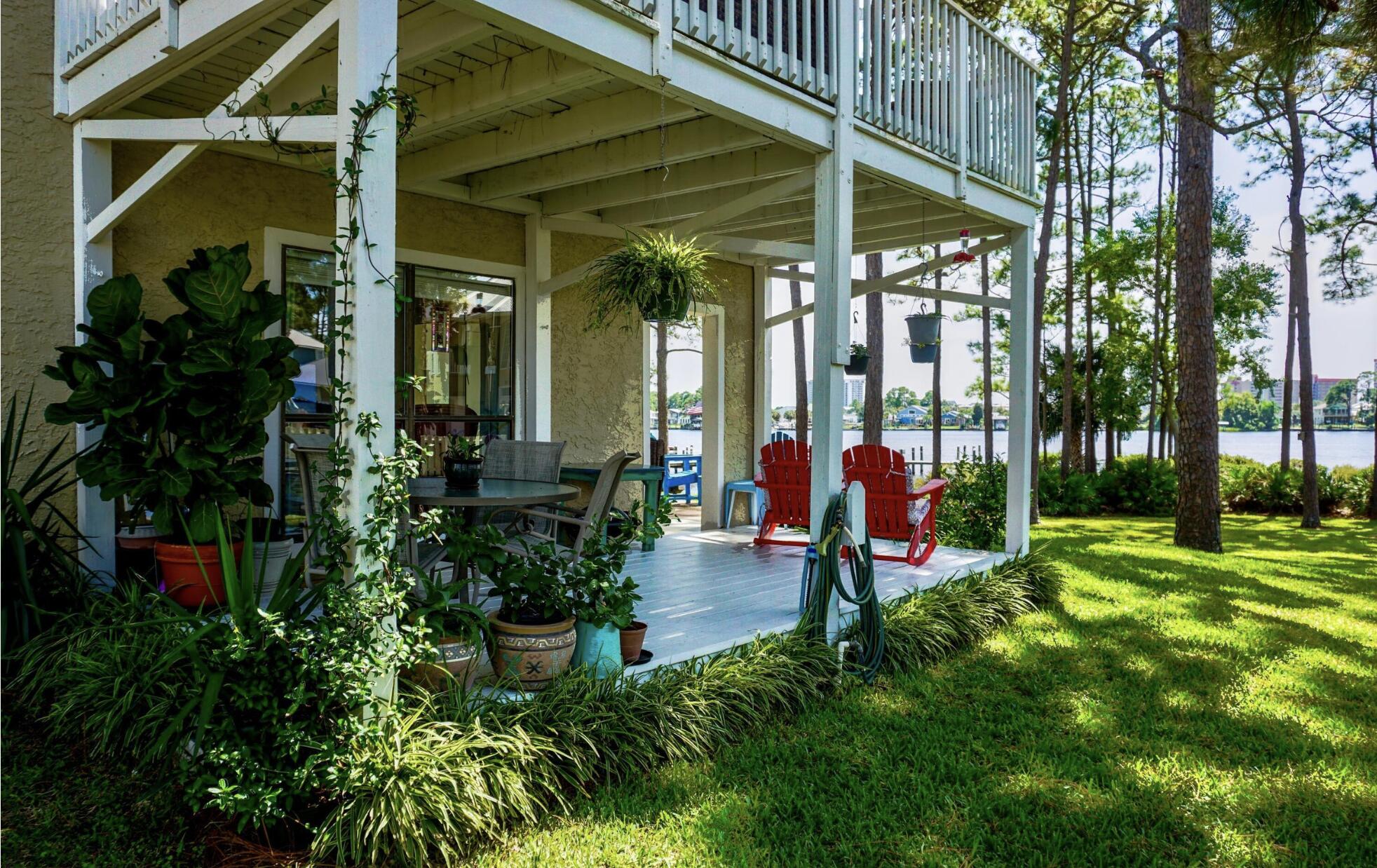 Discover your serene retreat at 6309 N. Lagoon - a ground floor, waterfront condo in Grand Lagoon Cove—a place where comfort meets elegance. This beautifully remodeled end unit offers an abundance of natural light and stunning views that will soothe your soul. Imagine sipping your morning coffee or enjoying evening drinks on the expansive wrap-around patio, surrounded by the tranquil sounds of nature and dolphins putting on a show. Completely taken down to the studs and thoughtfully redesigned in 2019, this condo boasts easy-to-maintain wood-look tile floors, modern kitchen cabinets, luxurious quartz countertops, and an exquisite backsplash that inspire culinary creativity. The clean lines of white craftsman-style crown molding and baseboards add a touch of sophistication that complements every space. With a newly rebuilt dock available for rent at just $150 per month (don't forget to sign up!), your water adventures await right at your doorstep. Enjoy fishing from the doc or hanging on the pavilion. Plus, with short-term rentals permitted for stays of 30 days or longer, this property is not only a home but also an opportunity for additional income. Nestled in a prime location near grocery stores, restaurants, and boat rentals, everything you need is just moments away. Don't miss out on the chance to call this spectacular condo your ownreach out to your favorite realtor today or schedule a private showing through our listing agent. Your dream lifestyle awaits! Please allow 2 hour notice for showing.