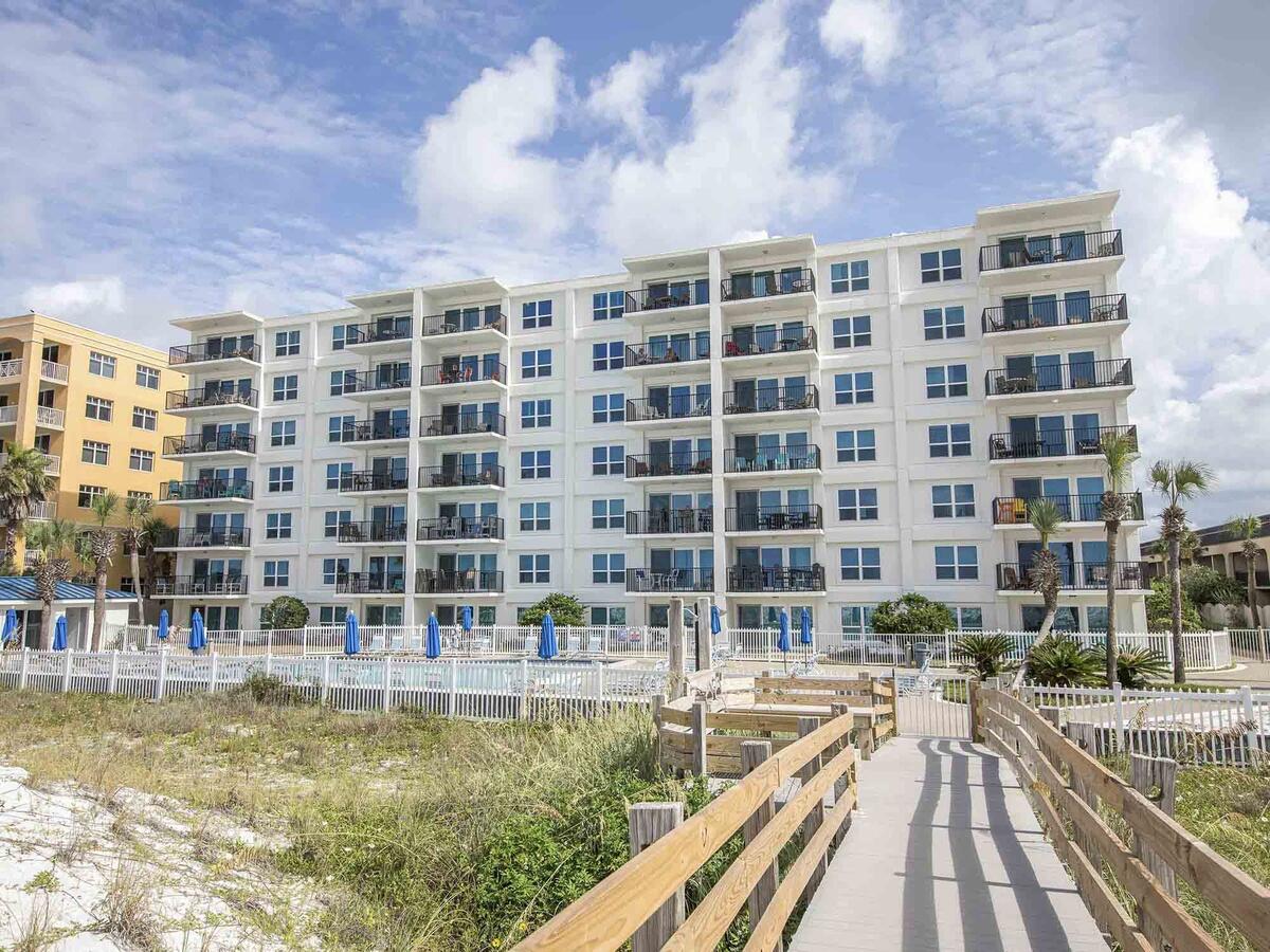 Greet the GULF VIEW as you wake up in the Master Suite of this 6th Floor CORNER condo! This updated 3 bedroom, 2 bathroom unit can be a vacation rental, 2nd home or your full time residence. The current owner has owned it for over 30 years. It's open floor plan features vinyl wood flooring. The Kitchen offers granite countertops, stainless appliances and a spacious bar. New AC & Heating unit Jul 2021. This beachy decorated condo is being sold fully furnished. Sea Oats feels fresh and inviting! Recent complex renovations include exterior paint, walkways, balconies, windows, and doors.  Sea Oats is also pet friendly. To see the virtual tour, go to Southern Vacation Rentals-vacation rentals-vacation condos-name, then select Sea Oats, then Unit #601.