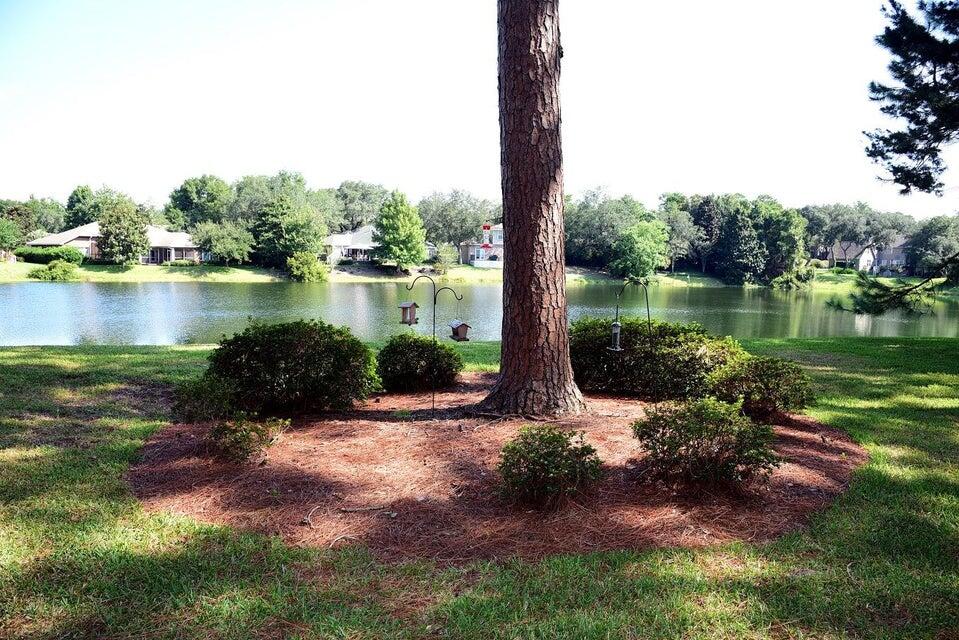 CHARMED BY NATURE? THIS COULD BE YOUR VIEW!!! This lakefront gem located in BLUEWATER BAY, is perfectly polished offering an ideal option for starter ,retirement, investment (rentals allowed), or vacation home. Tile flooring throughout, granite counter tops with breakfast bar, washer & dryer, and appliances. Screened enclosed porch is waiting for you, bring your coffee and relax enjoying the view waiting for you! HOA includes water, sewer and maintenance of the grounds.