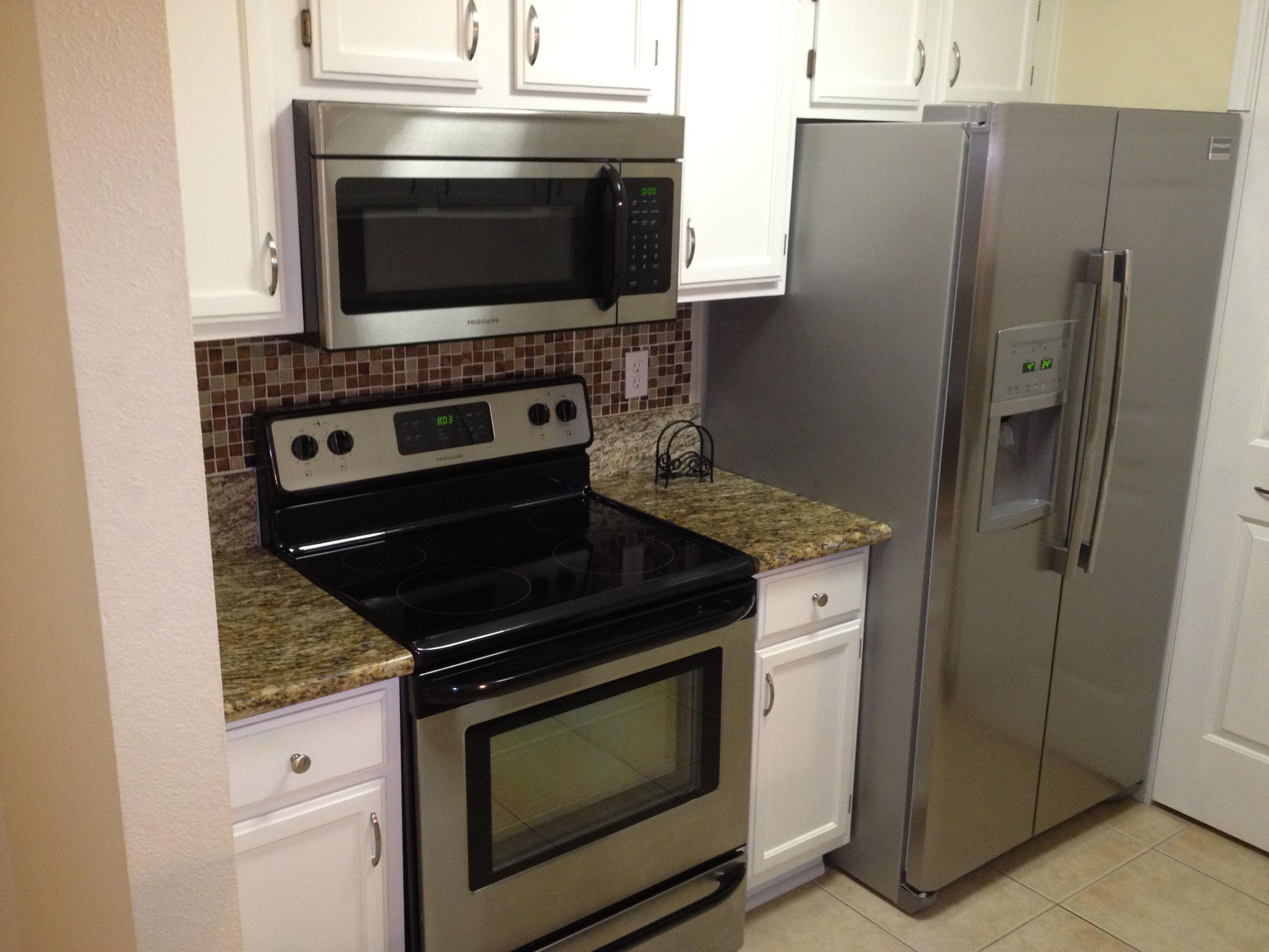 ** GROUND FLOOR, COMPLETELY UPGRADED UNIT ** This upgraded unit features all custom tile, granite counters in the kitchen and bath, custom finished breakfast bar with stained wood and glass tiles, built-in bench in dining area, stainless steel appliances including built-in microwave in the kitchen, and upgraded light fixtures. Located in the Heart of Destin, across the street from the dog park, shopping, and within a mile to the beach. Amenities include club house, pool, workout room, picnic area, etc.