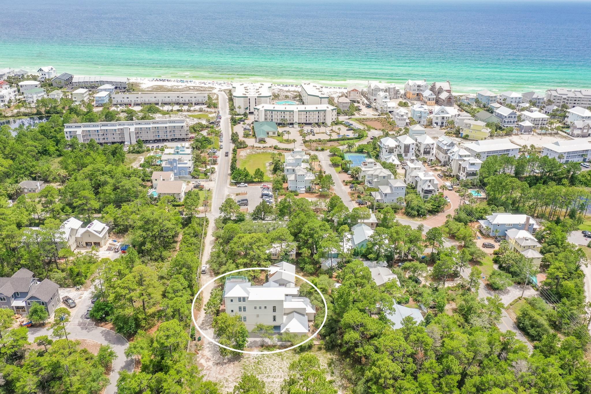 Located South of 30A with notable updates, this secluded luxurious residence with carriage house and private pool area is only footsteps away from the beach. Sold fully furnished, this renovated turn-key home is situated on an .27 lot with 5,771 square feet of living space spread over four floors with expansive outdoor living spaces perfect for entertaining. The first floor has an oversized living + sleep space with wet bar that opens directly to the custom pool area, in addition to a bathroom and laundry/mudroom with built-in storage. The second floor has an open concept kitchen, living, and dining area with separate kids area and powder bath. The gourmet kitchen has been fully remodeled with notable features including professional grade appliances, porcelain subway tile backsplash, dual fuel range with pot filler, built-in automatic espresso machine, and oversized walk-in pantry. The third floor offers a bunk area with built-ins for storage, junior master suite with en suite bathroom, and a spacious master suite with sitting area, en suite bathroom, and walk-in closet. The fourth floor consists of an abundant second master suite comprised of a fitness area with wet bar, three sitting areas, multiple closets and private 600 SF sundeck complete with gulf views. This area is perfect for enjoying an early morning cup of coffee, or sunsets in the evening! The single level carriage house features its own entrance, full kitchen, dining and living space, bedroom and full bathroom. Perfect for entertaining, the lush private outdoor oasis features fresh new landscaping, heated swimming pool with sun shelf, custom IPE deck area with trellises and architectural brackets, generous sitting/lounge area, fire pit and summer kitchen. Rinse off the sand from a day at the beach in the enclosed outdoor shower offering covered access to both the main and carriage house. 
From a rental standpoint, this home checks all the boxes: gulf views, private pool, carriage house, plenty of parking, and easy access to the beach! The home presents short term rental projections in excess of $200,000 annual rental income. 
Located in Seagrove Beach, this beachside house is ideal for a primary, second, or rental home due to its prime location off 30A, ease of accessibility to the beach, gulf views, seclusion, abundance of parking and no homeowners association, combined with close proximity to many of the favorite shops, restaurants and attractions the beautiful beaches of South Walton are known for.