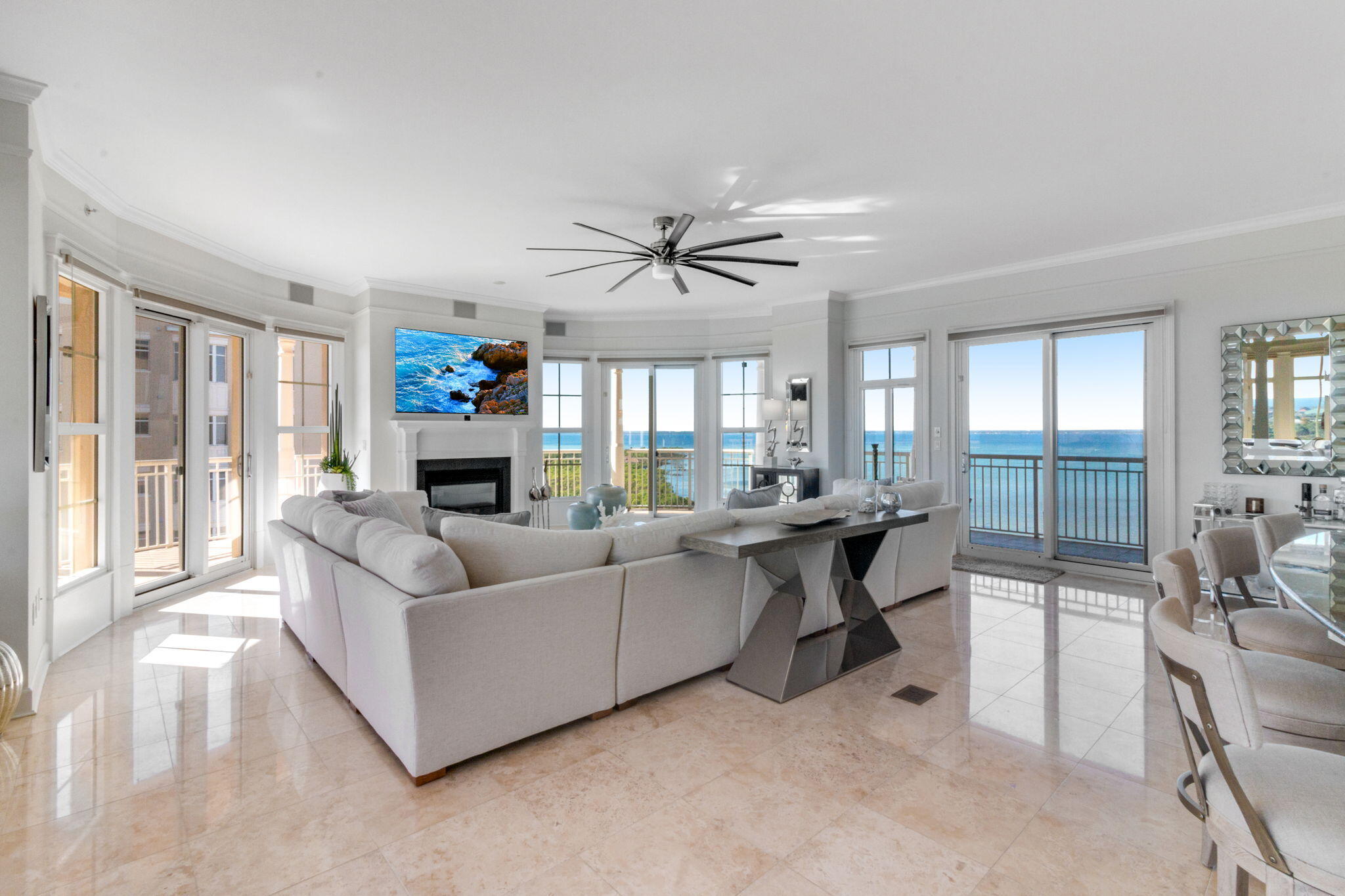 Experience the pinnacle of luxury living at Kelly Plantation's One Water Place, where this condo fosters an exceptional lifestyle. With panoramic views of the Kelly Plantation Golf Course 4th hole, Choctawhatchee Bay, Gulf of Mexico, and the Destin area, this incredible  condo sets the stage for a life of elegance and convenience.
This 3-bedroom, 3.5-bath unit features travertine floors in the living areas and plush carpeting in the bedrooms. Breathtaking views grace every room, enhancing every moment of luxury living. Refined light fixtures, treyed and raised ceilings, crown molding, and columns add an elevated air of sophistication to the space.
The open living areas coupled with the encompassing terrace make it the perfect place to entertain or MORE... The open living areas coupled with the encompassing terrace make it the perfect place to entertain or soak in those gorgeous Florida sunsets year-round.  The new grill and cabinets and dining area make it even more inviting. 
Convenience was foremost in its design, with a storage room next to the unit, kayak/paddleboard storage and extra storage in the garage. You'll have not one but two deeded parking spaces, plus parking for your golf cart. The amenities at One Water Place are unparalleled, offering a Bay Front pool, indoor & outdoor hot tubs, state-of-the-art workout facilities, sauna & steam room, a spa, members' lounge, Bocce ball courts, waterscapes and fountains, underground parking with reserved spaces, and even a car wash.
Additional amenities include putting greens, a wine cellar, juice bar, a crafting room, theatre, and a game room with billiards. There's even an owner's garden space and a dog park for your furry friends to enjoy. Plus, you'll have access to all the exclusive benefits of Kelly Plantation, making this condo an unparalleled opportunity for the discerning buyer.