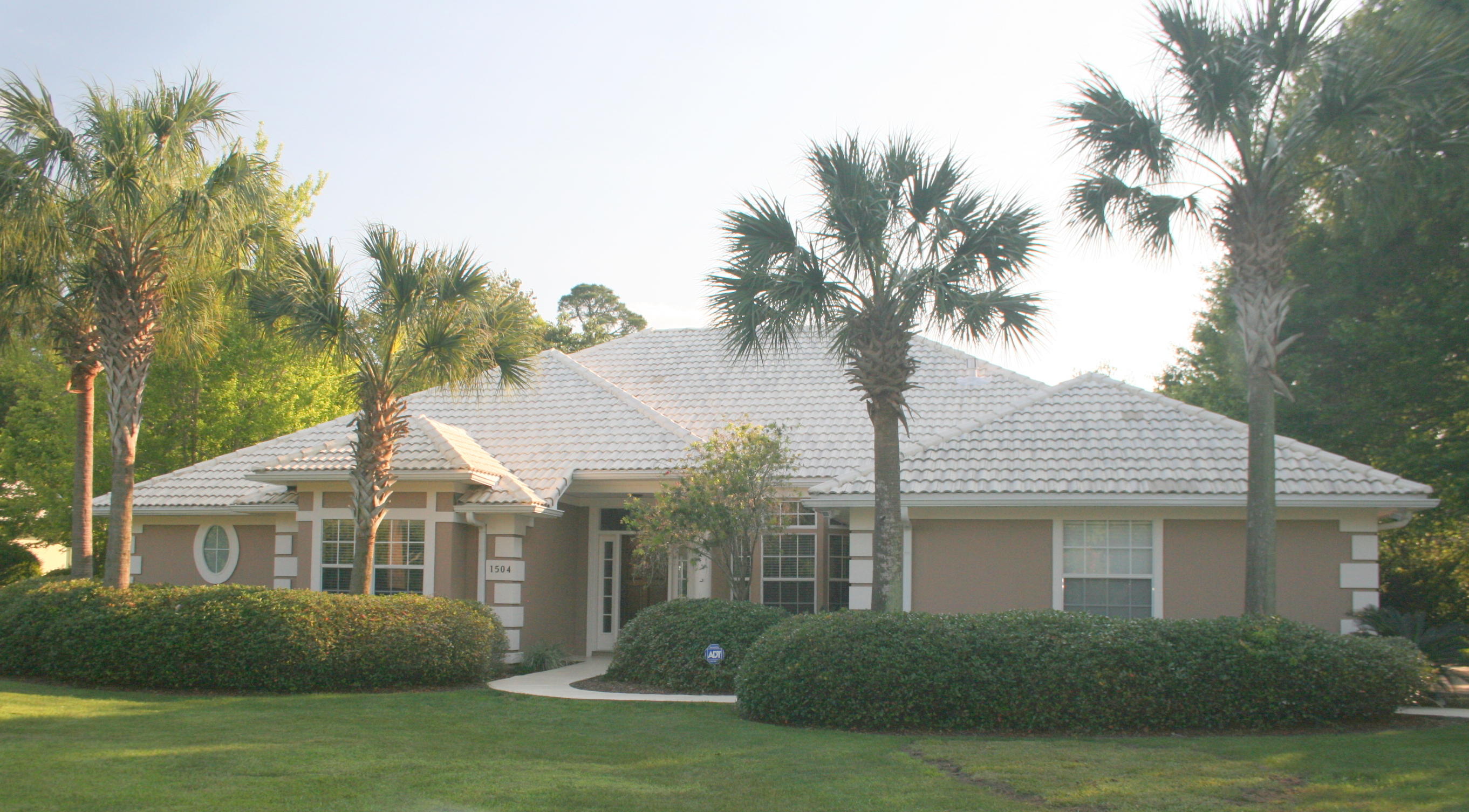 COMPLETELY RENOVATED golfcourse home with enclosed pool and hot tub on nearly 1/2 acre in the highly desired and private Glenlake neighborhood of Bluewater Bay. From top to bottom, this property lives up to today's high standards of luxury living! High ceilings and stunning, new Brazilian Koa hardwood floors are found in the living room, dining room, kitchen, master bedroom, office, and master closet with plush carpet in all the other bedrooms. This split, open floor plan home offers both formal and informal living areas that open up to the pool and lanai for increased living space! Upon entering this home, you will be captivated by the view through the family room out to the sparkling pool and 9th tee box of the Bluewater Bay Lake Course. To the left is a living space with a tray ceiling and a bay window.  Straight ahead is the vaulted ceiling family room that is completely open to the kitchen and breakfast area.  The family room features a gas fireplace, high ceilings, and a 3-panel "disappearing" glass door opening to the pool and lanai.  When these doors are fully opened, the family room and lanai feel like one large room which is a wonderful entertainment feature!  The amazing kitchen with a convenient breakfast bar offers granite countertops, stainless appliances, and refinished cabinets.  There is also a large pantry/utility room with an abundance of storage space right off the kitchen.  The split floorplan is designed with the master suite on one side of the house and 3 bedrooms with 2 baths on the other side. The master suite is actually a master "retreat" that pampers you with a romantic "see through" fireplace between the bedroom and bath!  The pampering continues with a luxurious whirlpool tub and incredible travertine shower with body massage jets!  To top it off, there is a huge, professionally organized walk in closet and a dual sink vanity with a granite top...WOW!  On the opposite side of this fine home, you will find 3 large bedrooms and two nicely updated baths.  Luxury living is not limited to the inside of this fine home.  The covered lanai, screened in pool, and hot tub area offer wonderful views of the golf course and you can still retain your privacy because of the thoughtfully designed landscaping.  The pool has been recently replastered and was redesigned to include a swim up bar between the pool and the hot tub for the ultimate in entertaining!  You will also enjoy the oversized, side-loading garage (with painted and sealed floor) with a wide driveway that allows for extra parking.  Other noteworthy improvements include: fully inspected stucco painted and sealed with elastomeric paint, pool deck coated with an acrylic sealer, pool heater and timer, screened-in pool enclosure, tile roof inspected and cleaned, incredible alarm/security system with glass break and motion sensors, plumbing hardware replaced, and a recently installed hot water heater.  To top it off, this home is 5 minutes from award winning Bluewater Elementary and zoned for Ruckel Middle and Niceville High Schools, some of the best in the entire state.  See this home for yourself and you will agree it is luxury living at its finest!!  Buyer to verify dimensions.